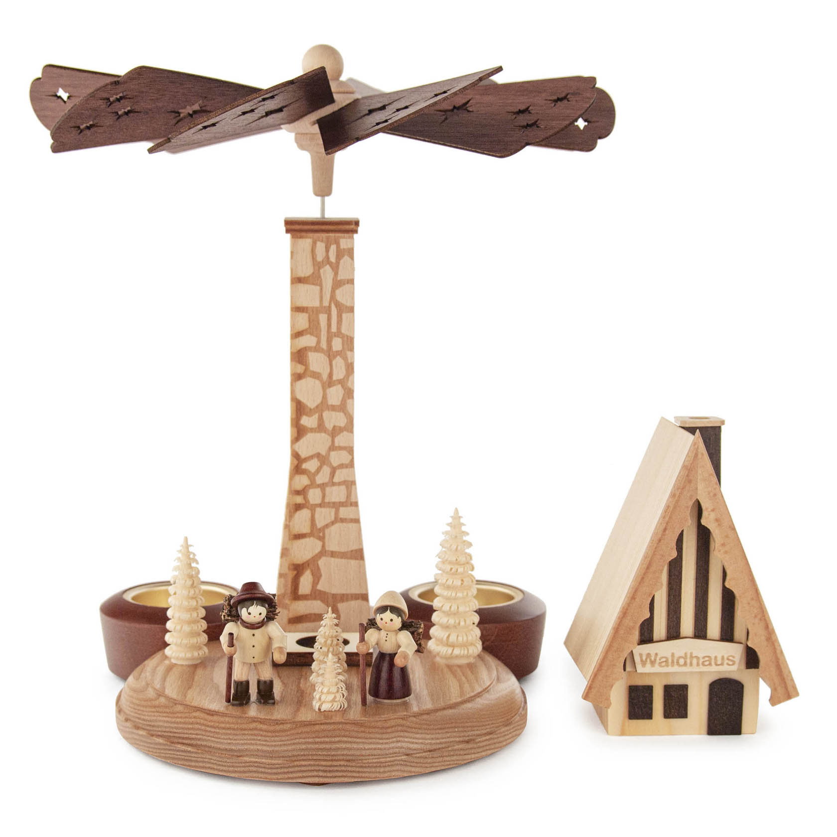 A wooden incense pyramid featuring a tall tower with a fan on top, two small wooden figures in front, and an adjacent small wooden house labeled 'Waldhaus'. There are spaces for tealights.