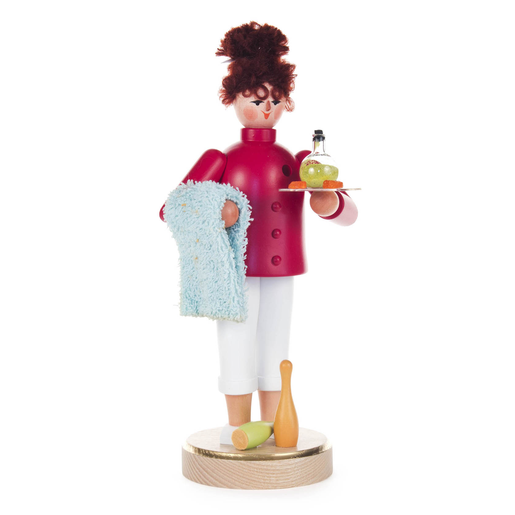 A smoking woman incense figure dressed as a physiotherapist, holding a towel and tray with a small bottle, standing on a wooden base. im Dregeno Online Shop günstig kaufen