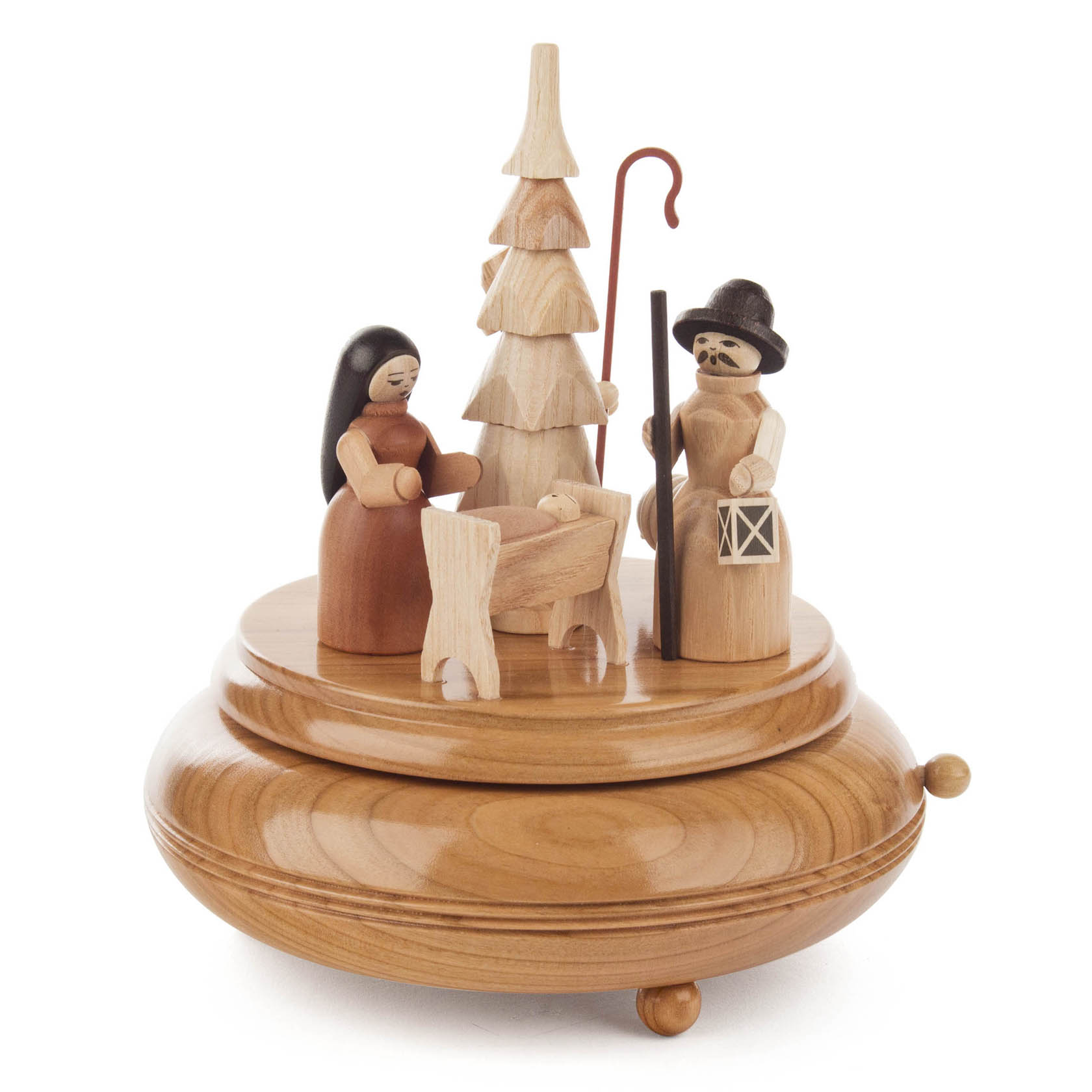 Eine handgefertigte Spieldose aus Holz mit Krippenfiguren: Maria, Josef mit Laterne und Jesus in der Krippe, dazu ein Baum und eine Hirtenfigur. im Dregeno Online Shop günstig kaufen