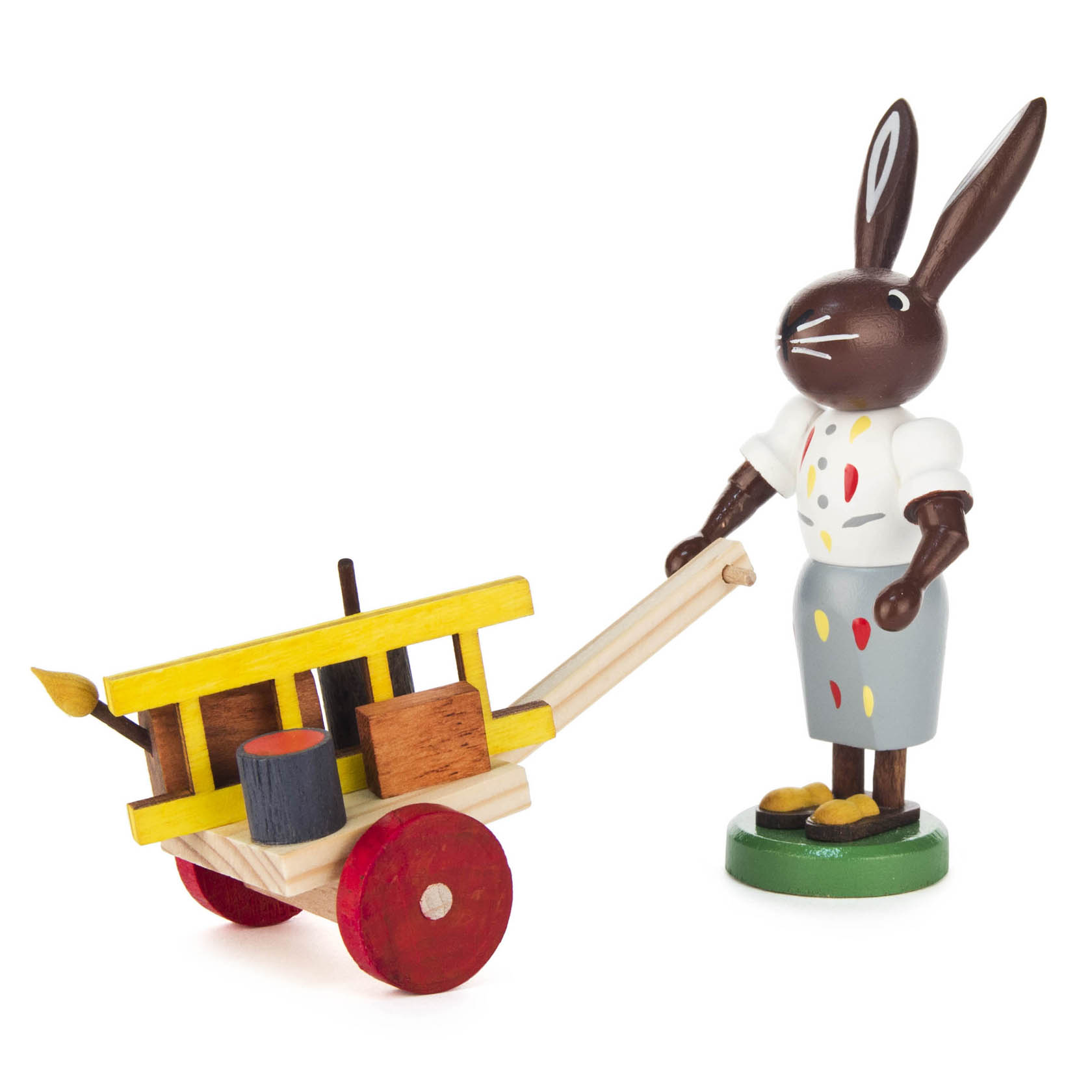 Holzfigur eines Hasen in Malerkleidung, der eine Schubkarre mit Malutensilien wie Fässern und einem Pinsel schiebt. im Dregeno Online Shop günstig kaufen
