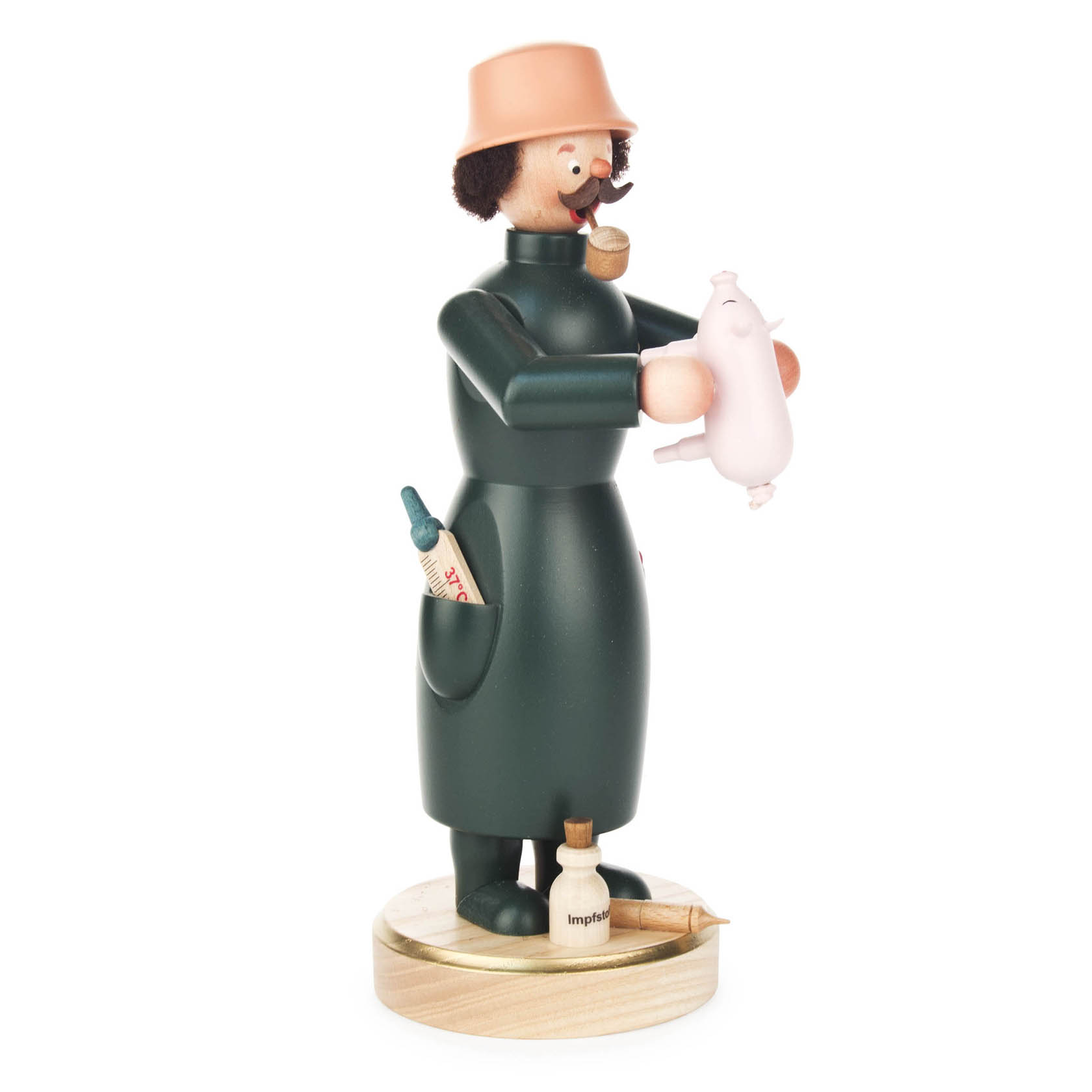 A wooden figurine of a veterinarian holding a small pig, wearing a green coat and a brown hat, with medicine bottles in his pockets. im Dregeno Online Shop günstig kaufen