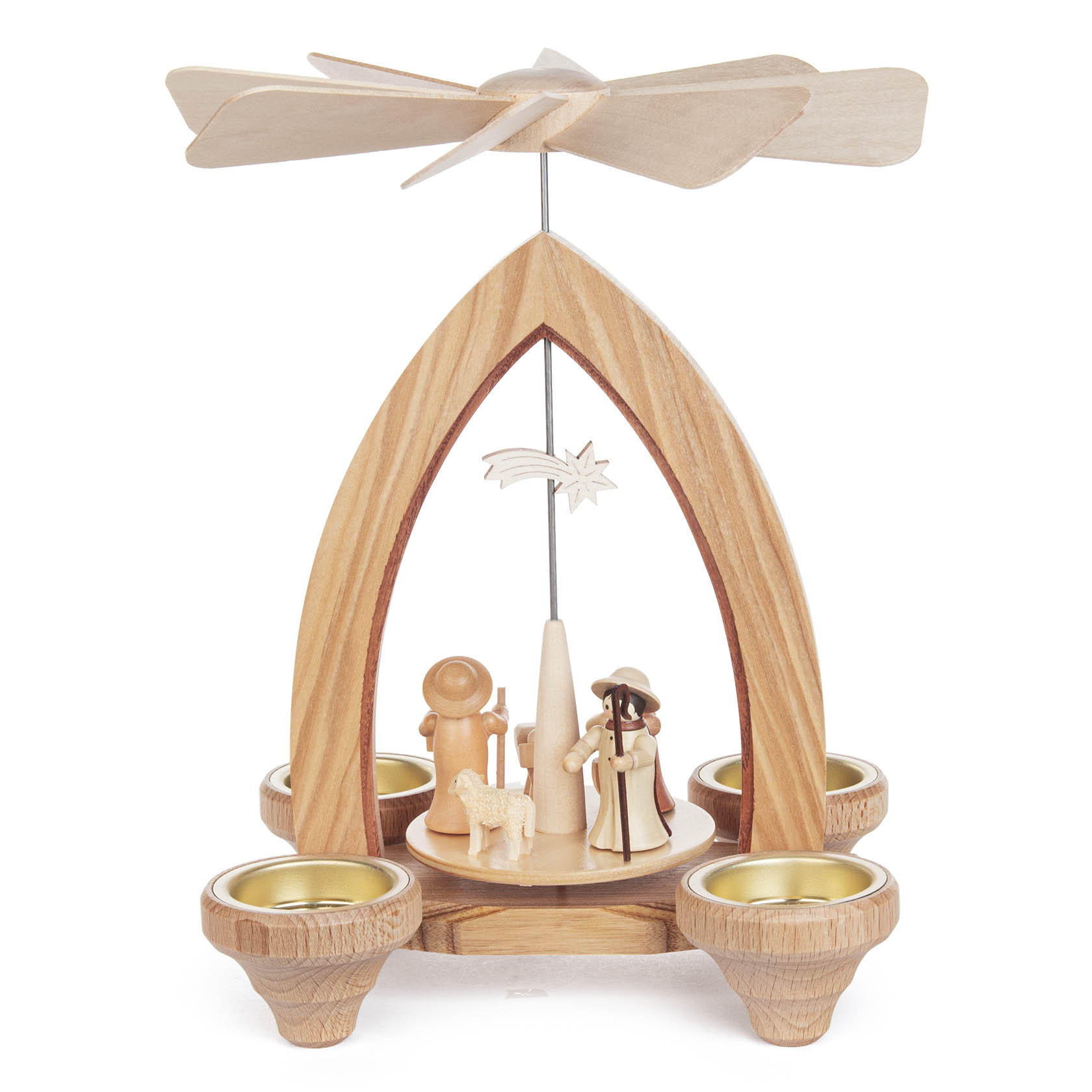 A wooden Christmas pyramid featuring the Nativity scene, with four tealight holders at the base and a rotating fan at the top.