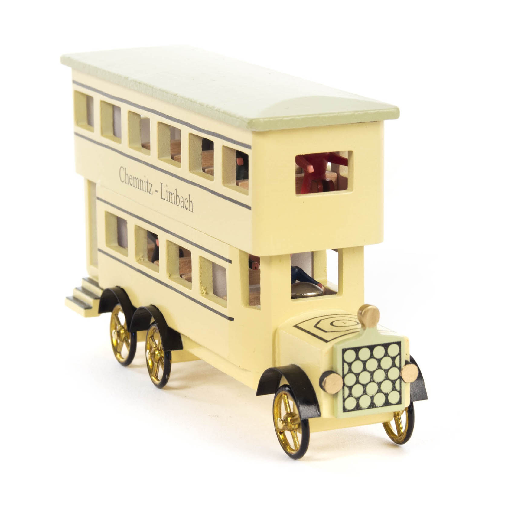Ein cremefarbener Miniatur-Doppelstockbus mit schwarzem Dach und goldenen Akzenten. Auf der Seite steht 'Chemnitz - Limbach'.