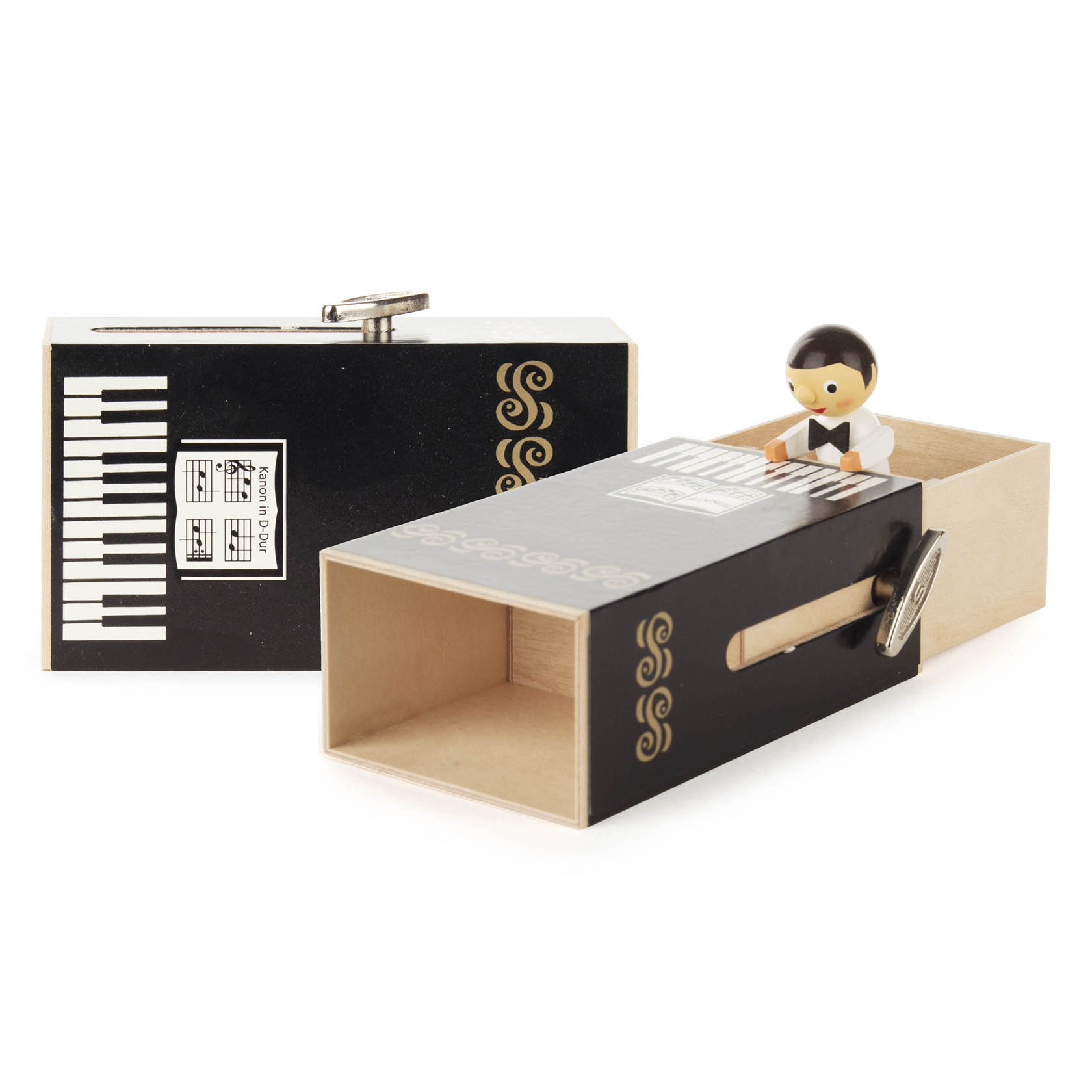 Eine Schiebebox in Form eines Klaviers, aus der ein Junge herausschaut. Auf der Box ist der Notenschlüssel und Klaviertasten abgebildet. im Dregeno Online Shop günstig kaufen