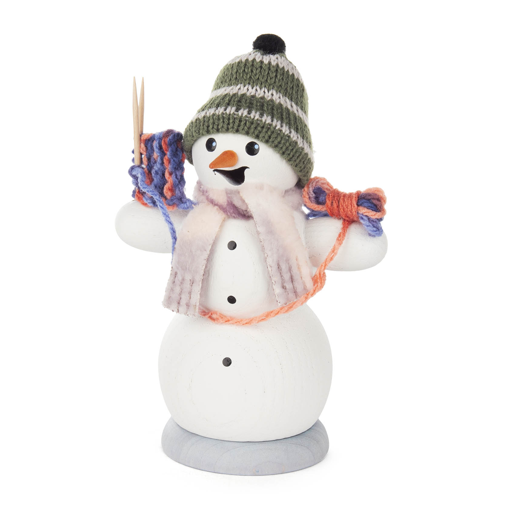 Wooden snowman incense smoker holding knitting needles and yarn, wearing a beanie and scarf.
