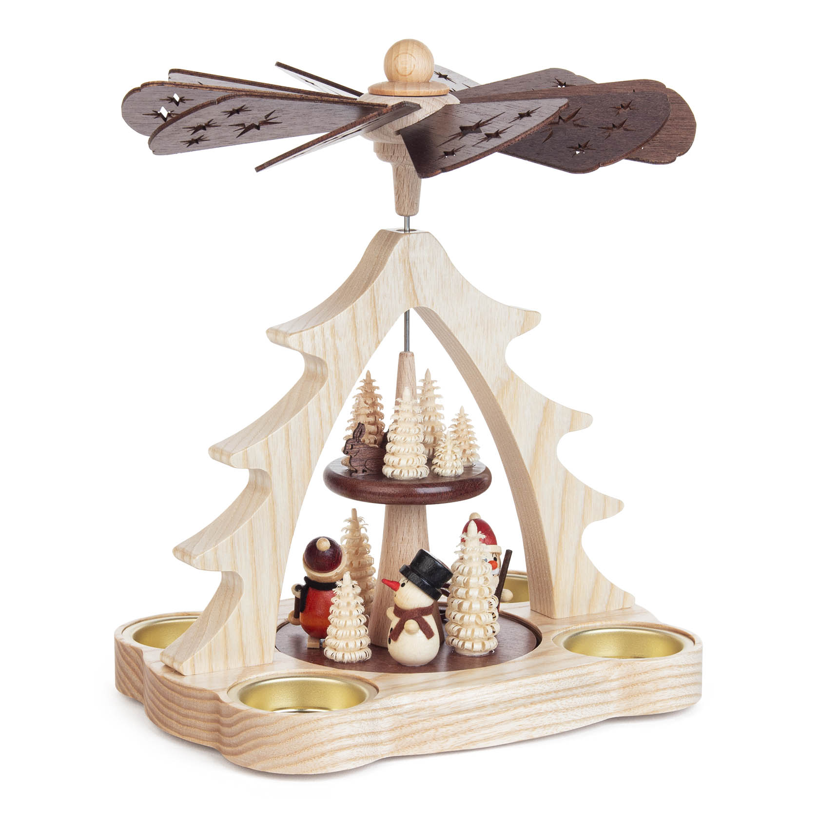 A wooden Christmas pyramid featuring a Santa Claus and snowman figurine surrounded by small, white Christmas trees. Four candle holders are placed on the base.