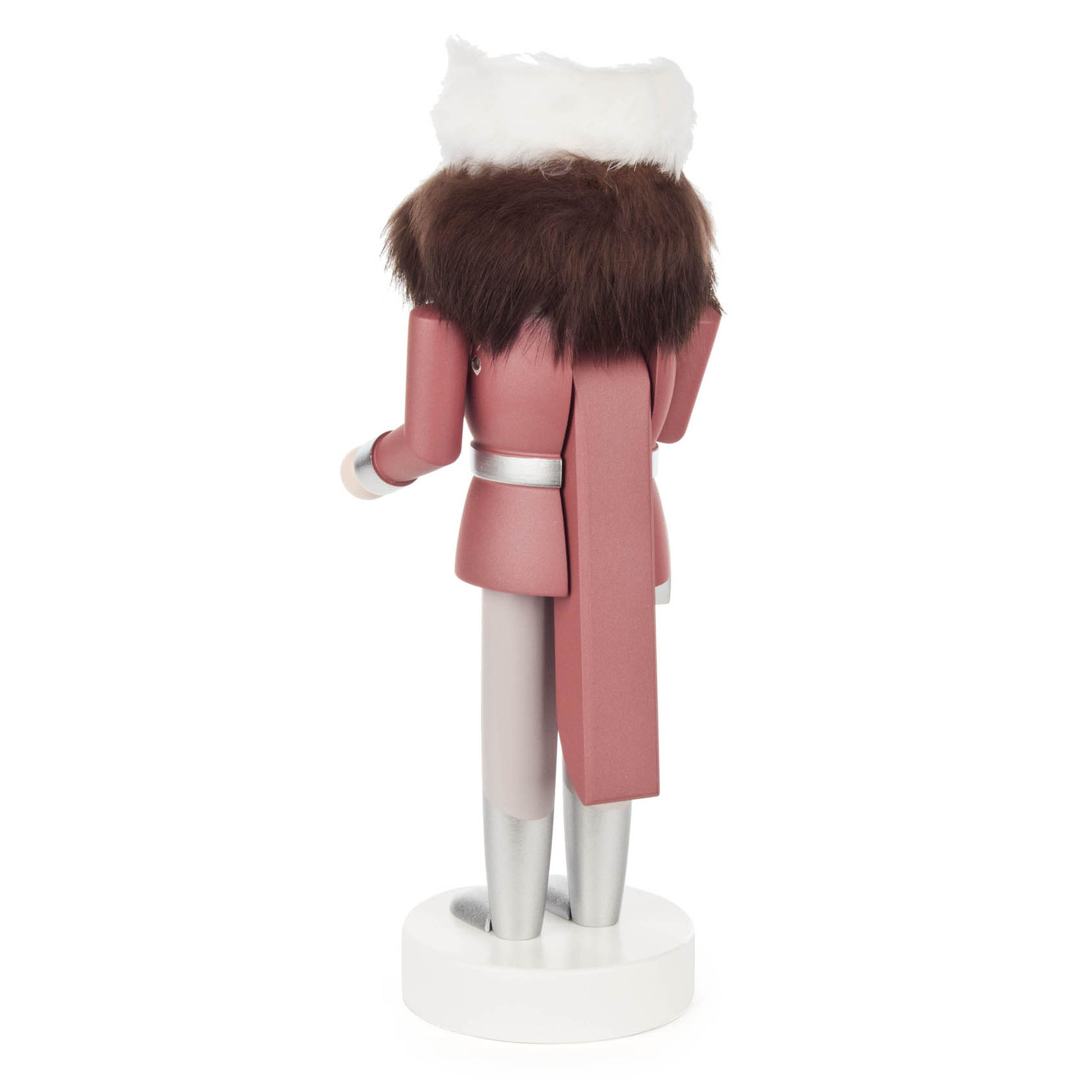 A 25 cm tall nutcracker figure of a woman dressed in pink with silver accents, wearing a white hat and brown fur scarf, viewed from the back.