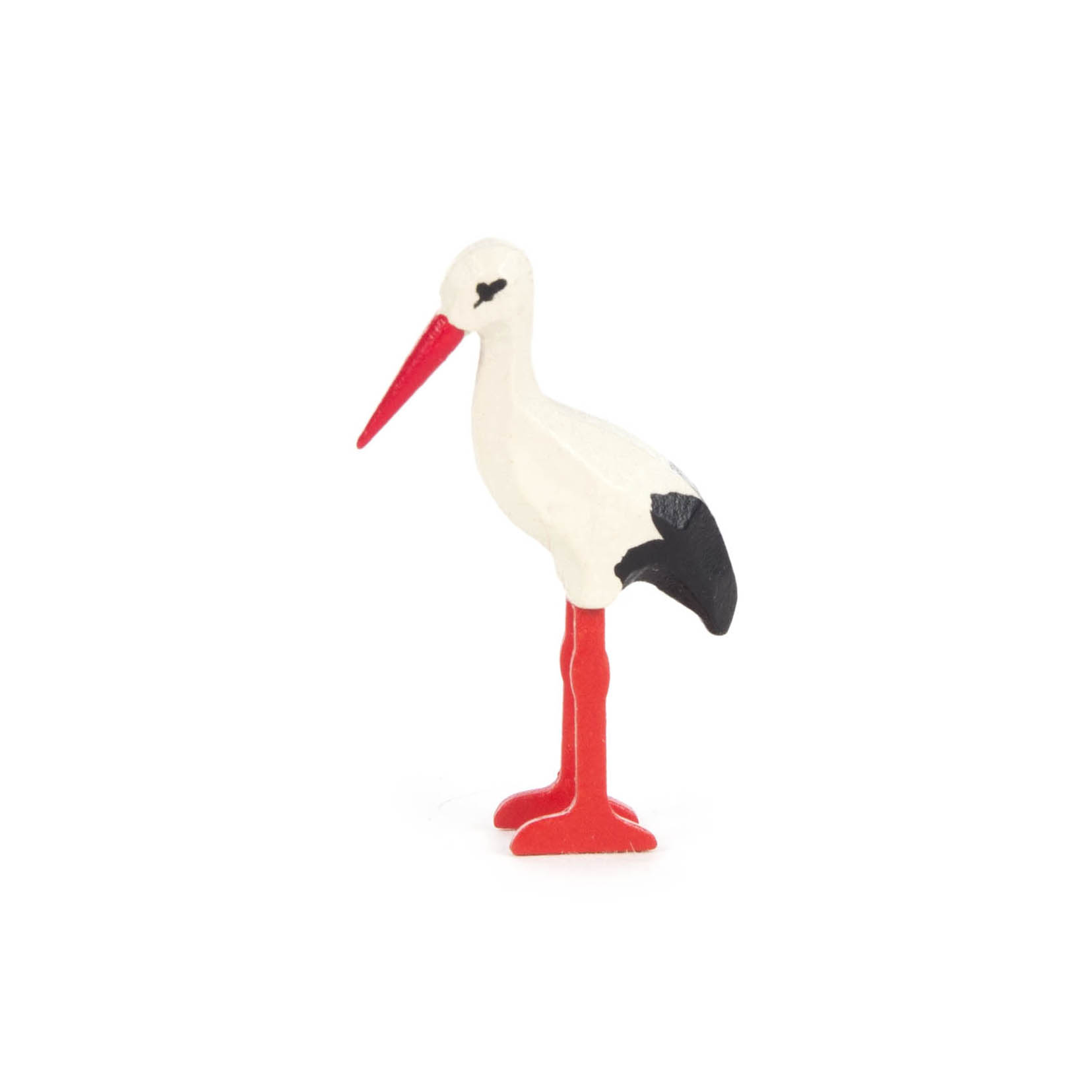 Eine kleine Figur eines Weißstorchs mit weißem Körper, rotem Schnabel und Beinen sowie schwarzen Flügelspitzen. im Dregeno Online Shop günstig kaufen