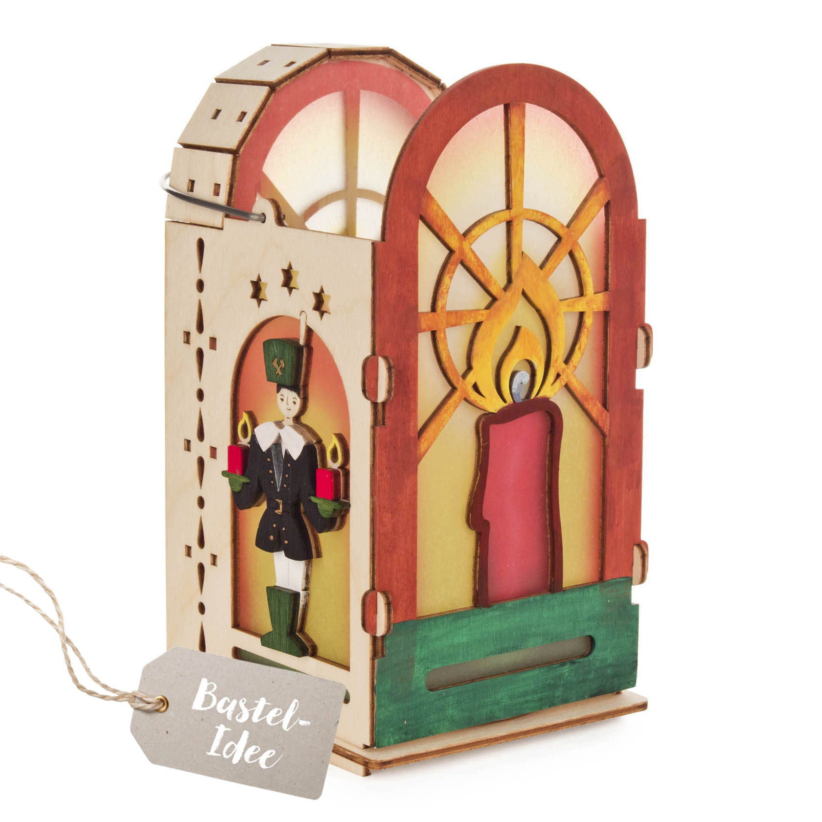 A DIY lantern set from the Erzgebirge featuring a wooden arched design with a candle motif and a toy soldier holding gifts on the side. im Dregeno Online Shop günstig kaufen