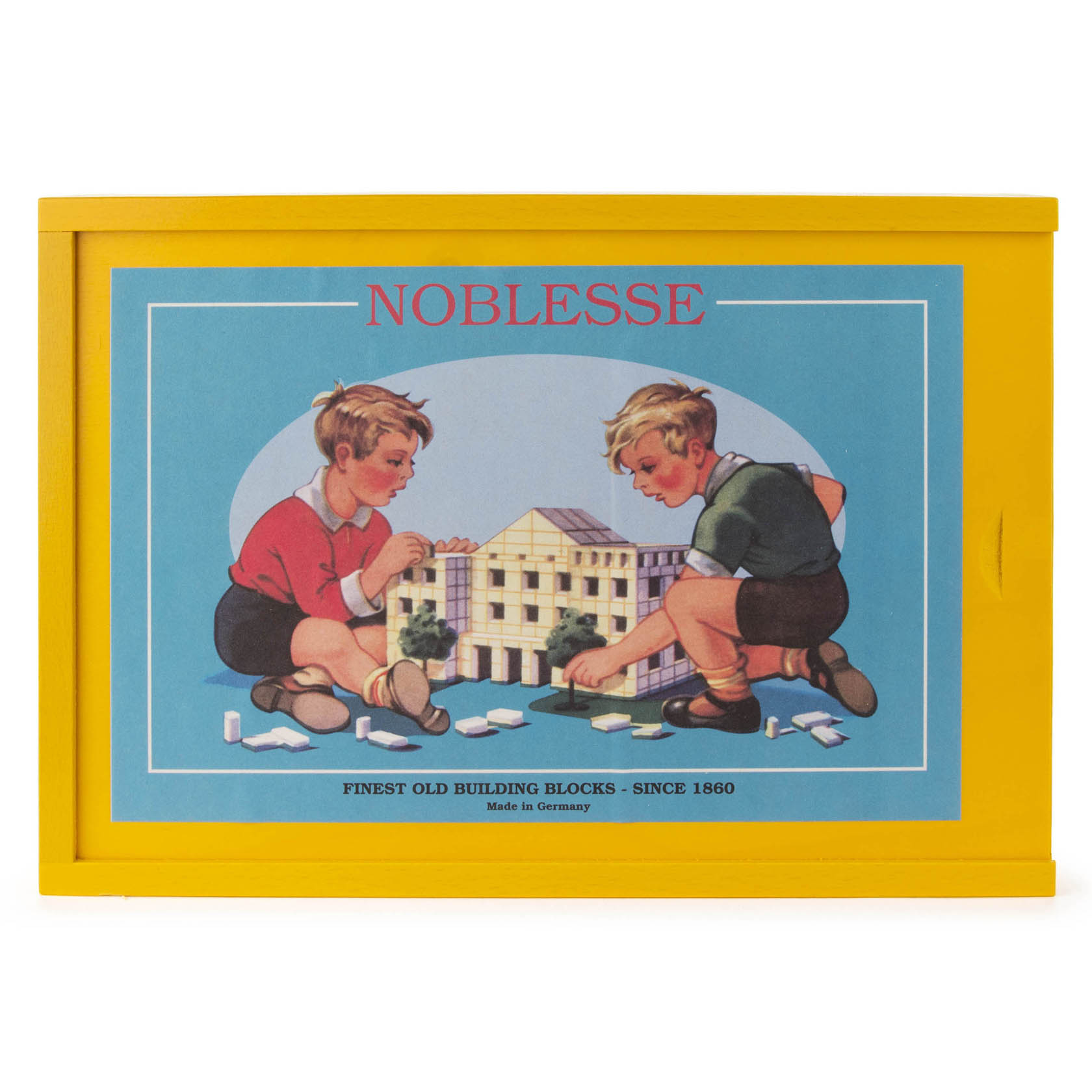 Zwei Kinder spielen mit einem Baukasten namens 'Noblesse', auf dem Deckel ist ein Bild der Kinder vor einem Modell eines Gebäudes zu sehen.