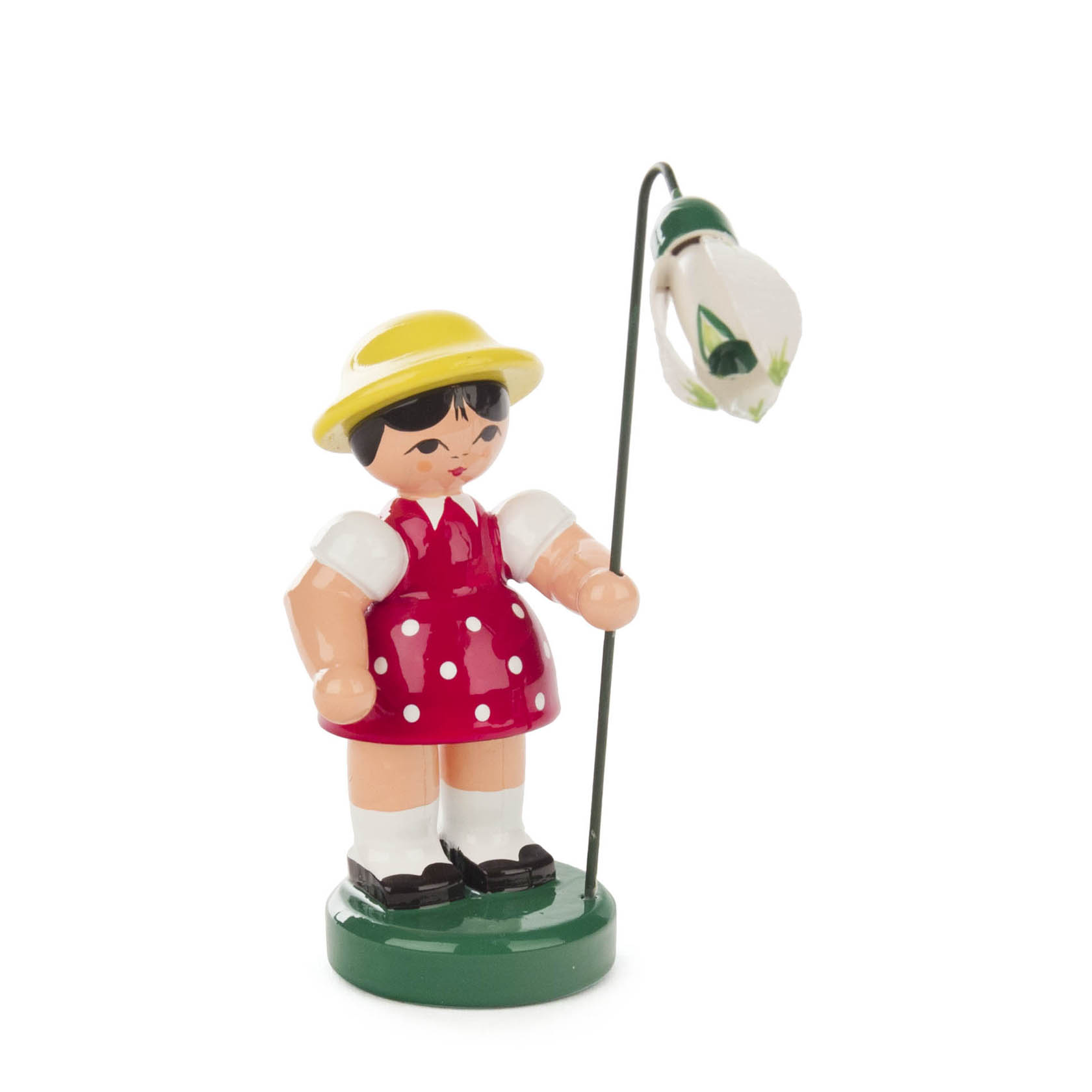 Holzfigur eines Mädchens in dunkelrotem, gepunktetem Kleid mit gelbem Hut hält eine weiße Blume an einem Stab. im Dregeno Online Shop günstig kaufen