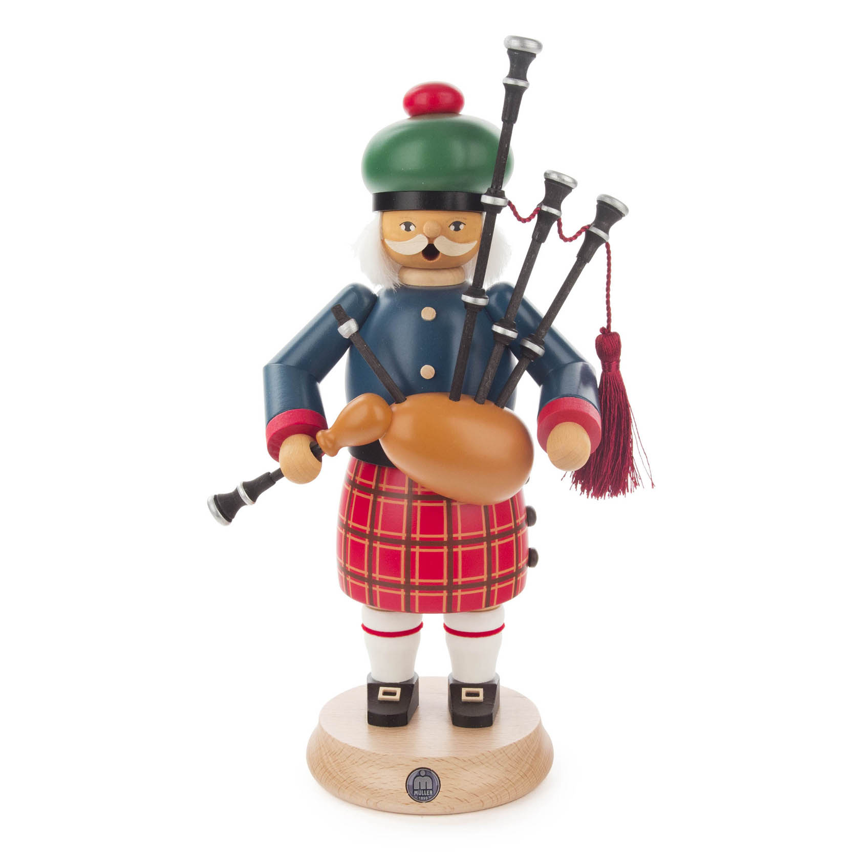 Holzfigur eines Schotten mit grünem Barett, rotem Kilt und blauem Jacke. Er trägt einen Dudelsack und hat ein freundliches Gesicht mit Brille. im Dregeno Online Shop günstig kaufen