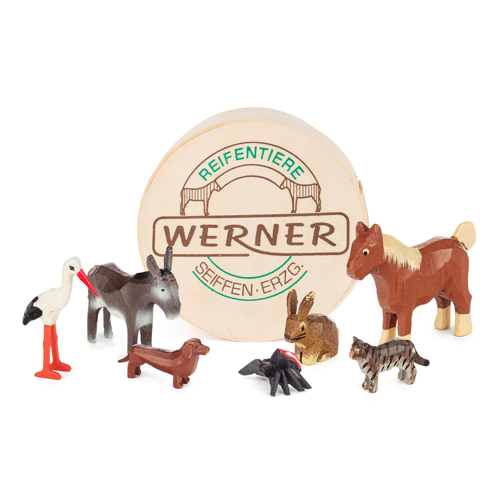 Eine Spandose mit der Aufschrift 'WERNER Reifentiere Seiffen-Erzgeb.' und sechs Holzfiguren: Pferd, Storch, Hund, Esel, Schaf und Hase. im Dregeno Online Shop günstig kaufen