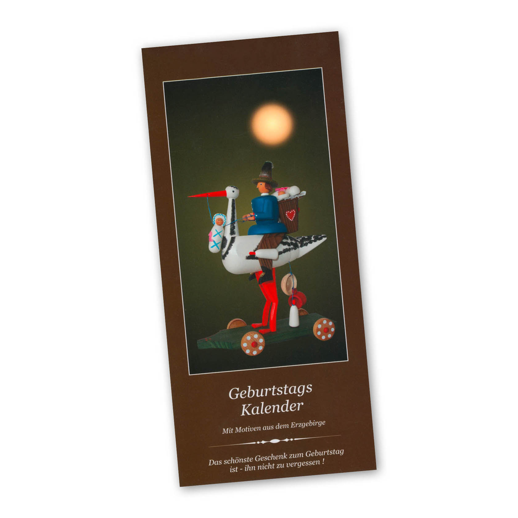 A birthday calendar cover featuring an Erzgebirge figure of a colorful bird carrying a small man with gifts in traditional attire. im Dregeno Online Shop günstig kaufen
