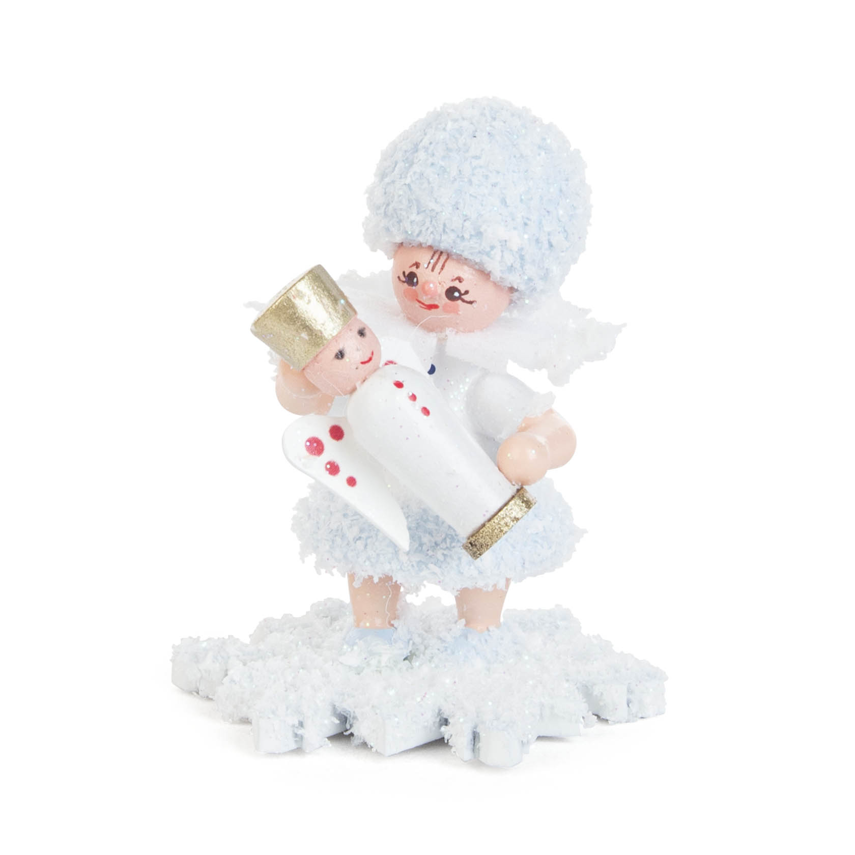 A small, cheerful figurine of a snowflake girl dressed in a fluffy blue and white outfit, holding a tiny angel figure with a golden crown. im Dregeno Online Shop günstig kaufen