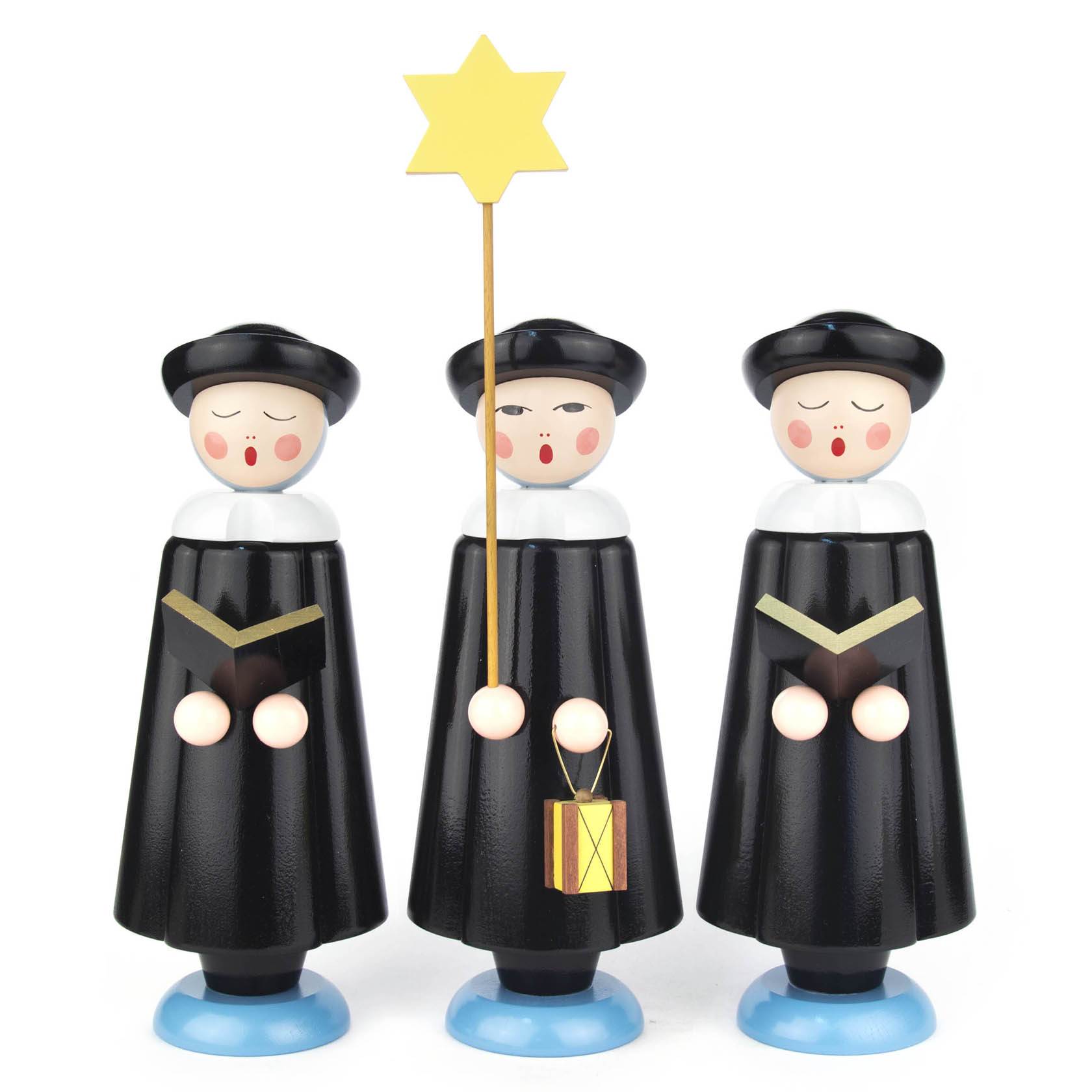 Drei handgefertigte Kurrendefiguren in schwarz mit runden Hüten. Die mittlere Figur hält einen gelben Stern und Laterne, die anderen zwei halten Bücher. im Dregeno Online Shop günstig kaufen