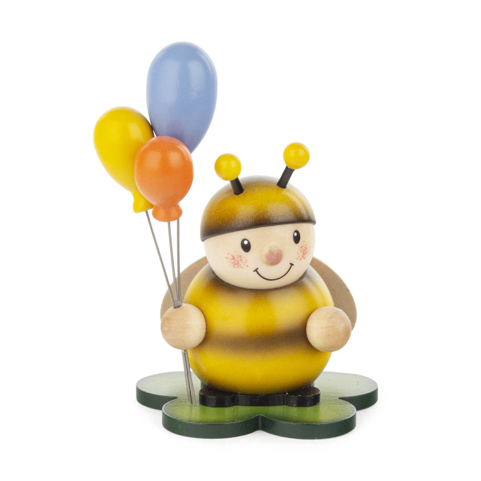Holzfigur einer lächelnden Hummel in gelb-schwarz mit drei bunten Luftballons in der Hand, auf einem grünen Standfuß stehend. im Dregeno Online Shop günstig kaufen