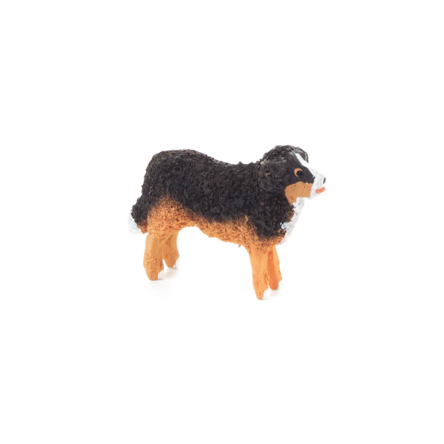 Kleine Spielzeugfigur eines Berner Sennenhundes, braun-schwarz mit weißen Markierungen. im Dregeno Online Shop günstig kaufen