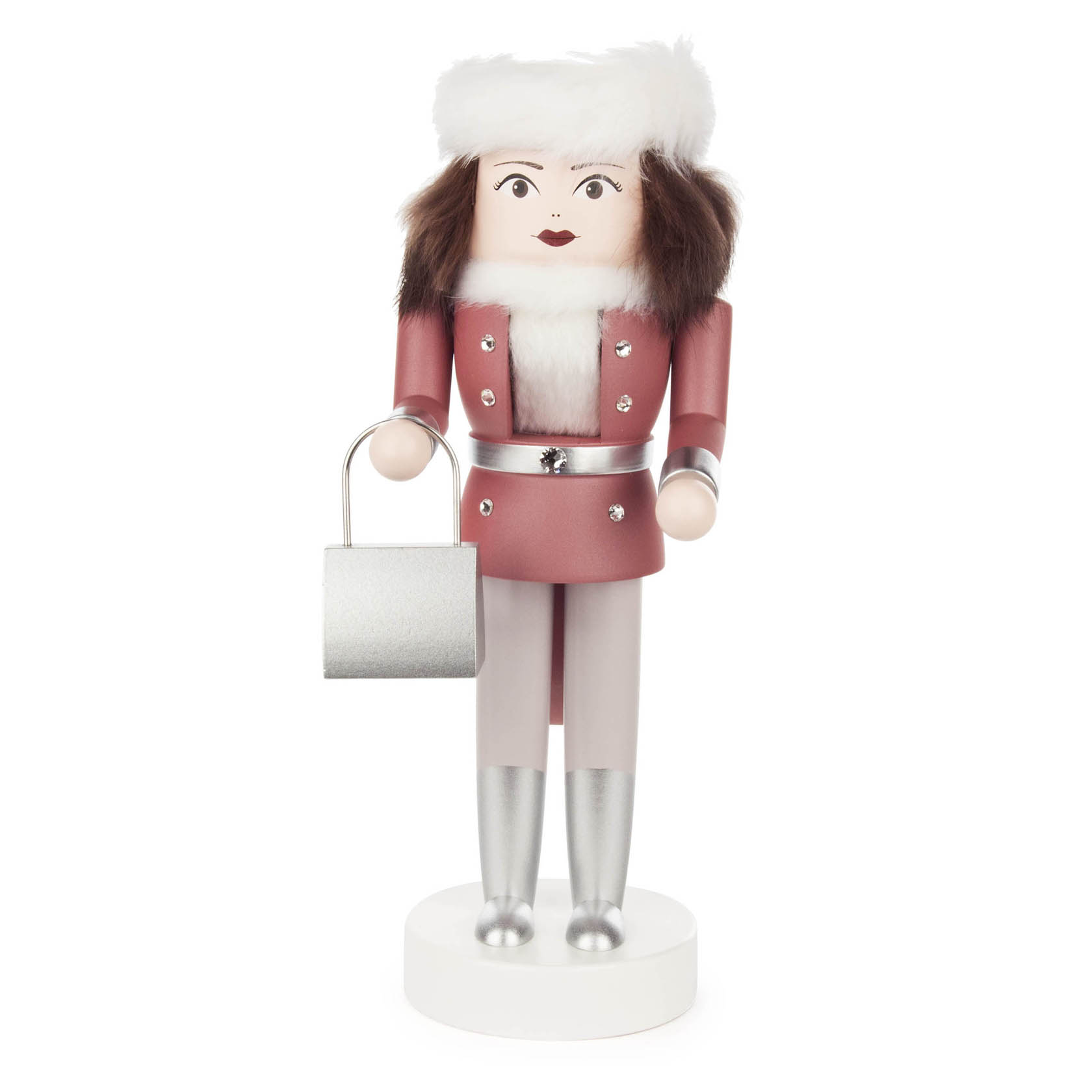 A pink 25cm nutcracker doll dressed as a woman with white fur hat and collar, holding a silver handbag. im Dregeno Online Shop günstig kaufen