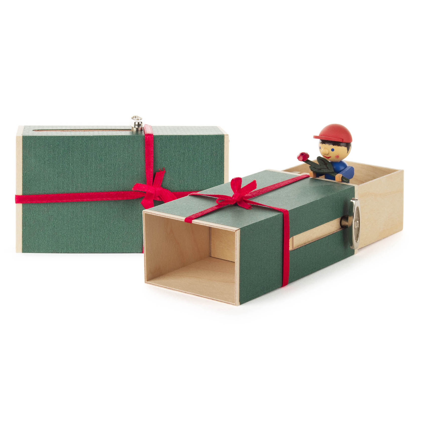 Musikspieluhr in Form einer grünen Schachtel mit rotem Band, geöffnet mit einer Figur eines Jungen in blauem Outfit und rotem Helm, der eine Blume hält. im Dregeno Online Shop günstig kaufen