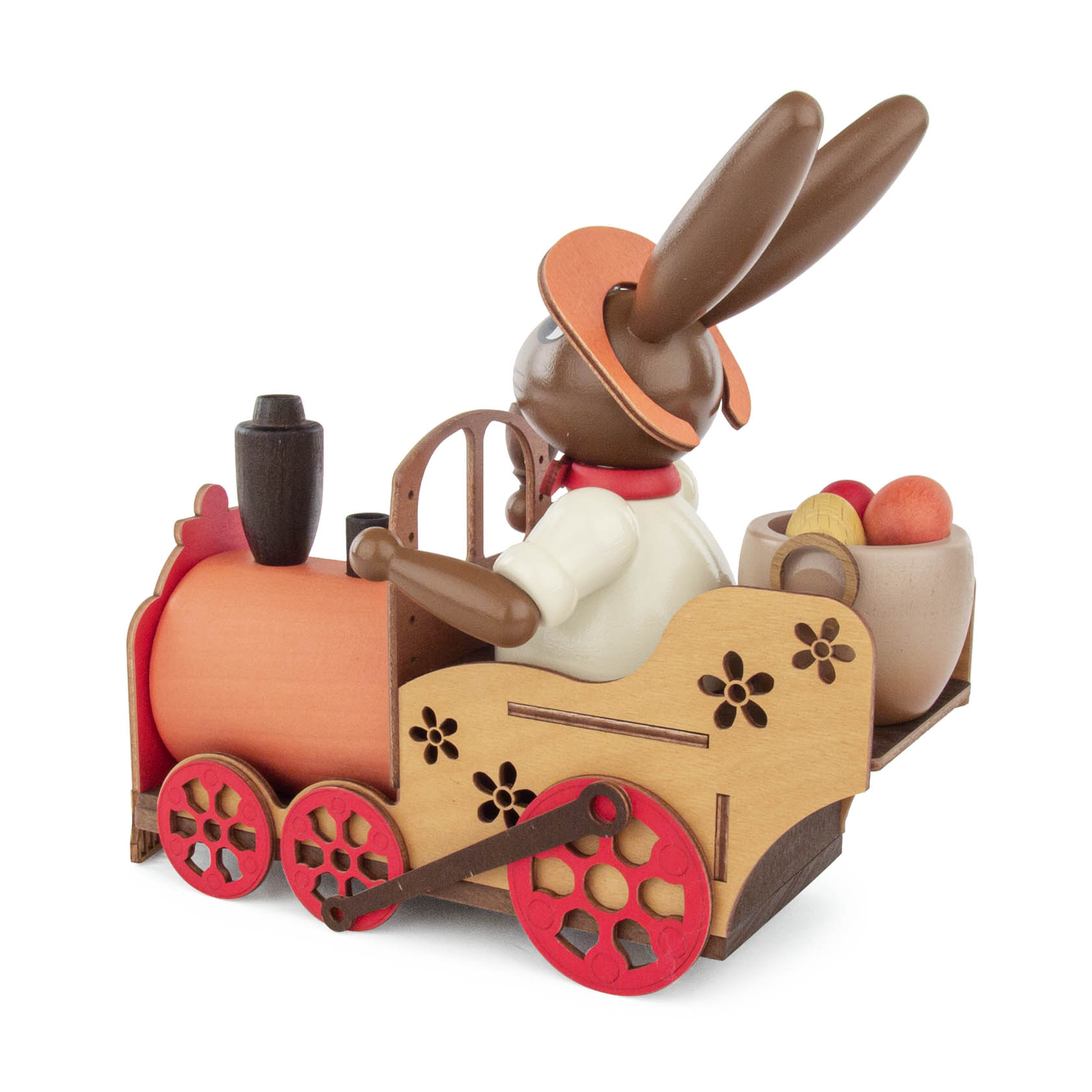 A wooden incense smoker rabbit sitting on a decorative locomotive, holding a pipe with a basket of colored eggs behind it.