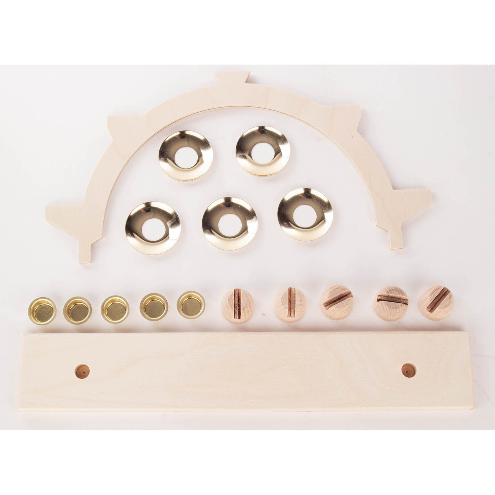 A DIY Schwibbogen set including a wooden semicircular arch, base, metal candle holders, and wooden peg components.