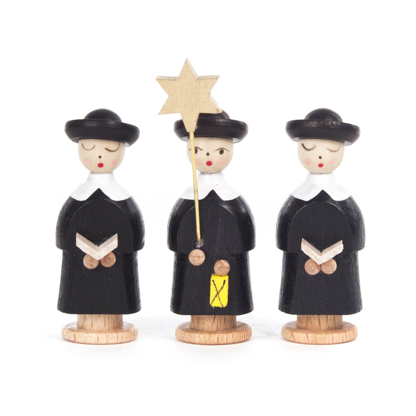 Drei schwarze Kurrendefiguren aus Holz, alle mit Hut und weißem Kragen, eine mit einem Stern in der Hand, auf Holzsockeln stehend. im Dregeno Online Shop günstig kaufen