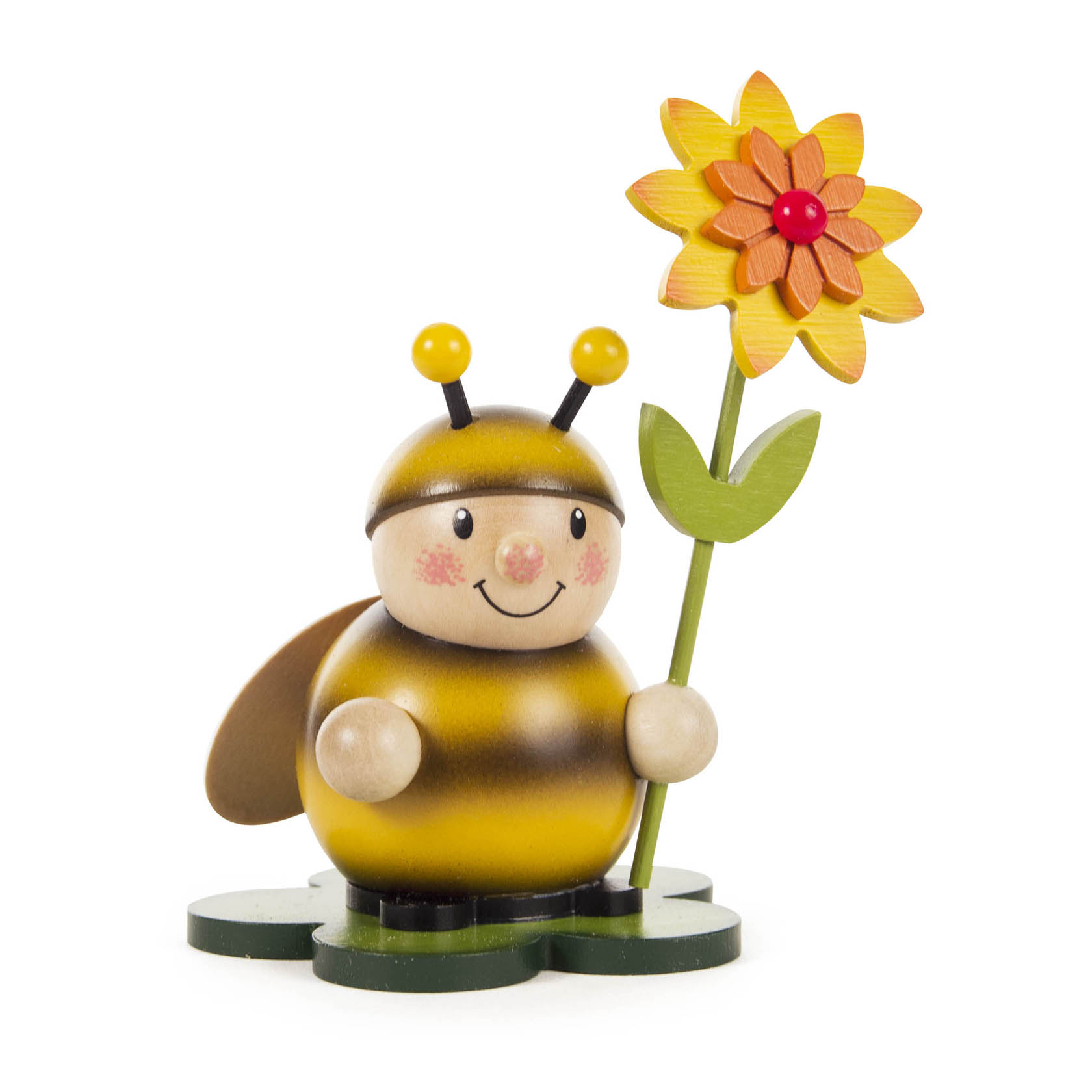Holzfigur einer lächelnden Hummel mit gelber Blüte auf einer grünen Basis. im Dregeno Online Shop günstig kaufen