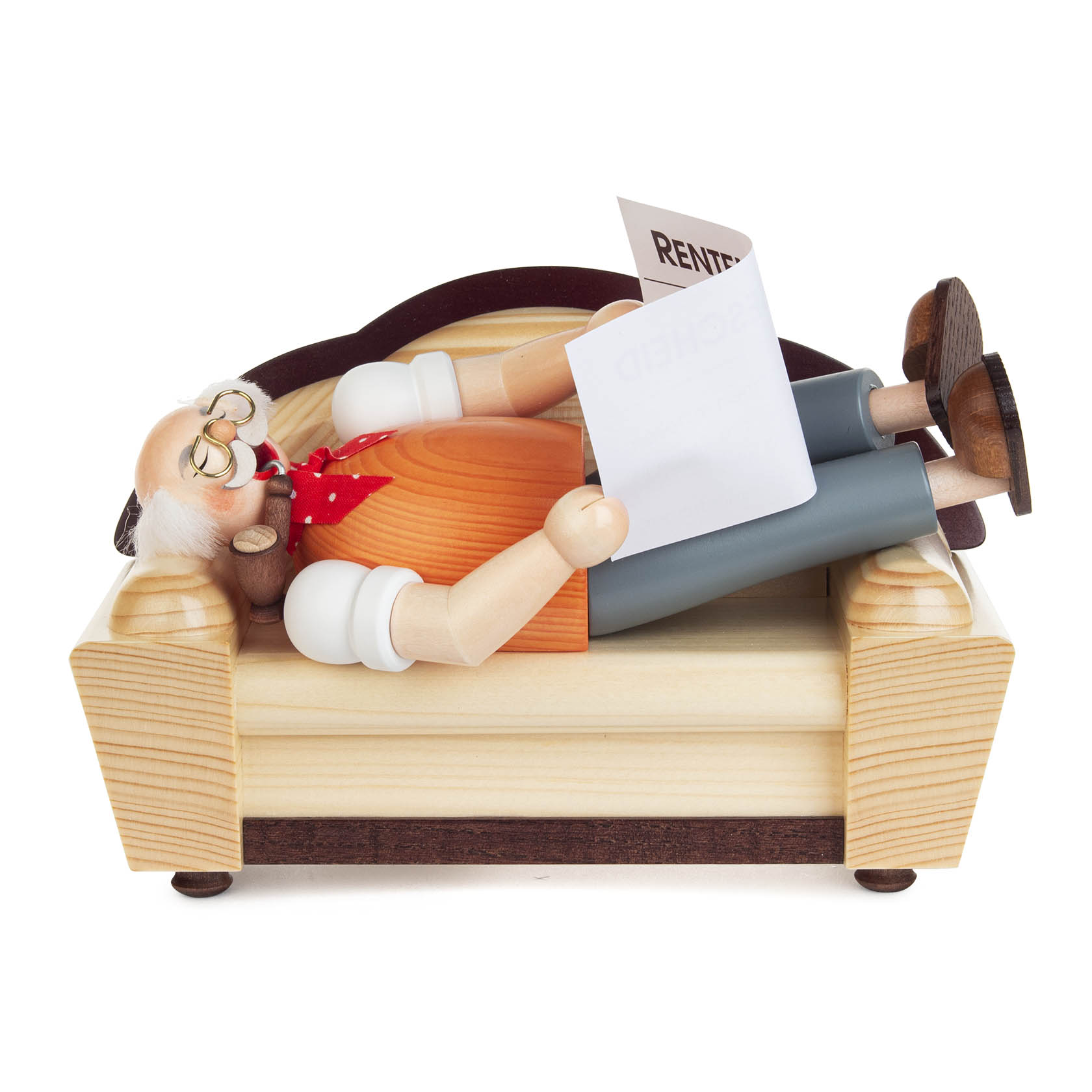 Wooden smoking figure of a retired man resting on a sofa, holding a pipe, wearing glasses, and reading a newspaper. im Dregeno Online Shop günstig kaufen