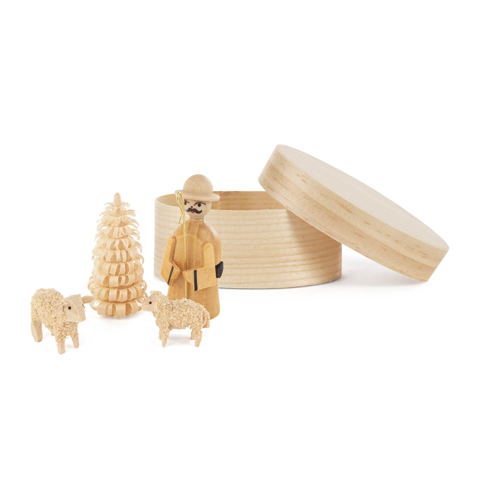 Holzfiguren-Set bestehend aus einem Schäfer mit Stock, zwei Schafen und einem Baum, präsentiert in einer geöffneten, runden Spandose. im Dregeno Online Shop günstig kaufen