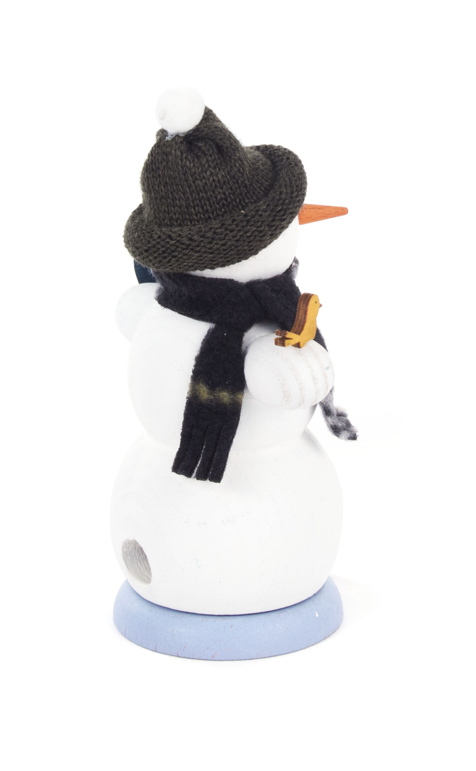 Smoking snowman figurine with a snowboard, wearing a dark hat and scarf.