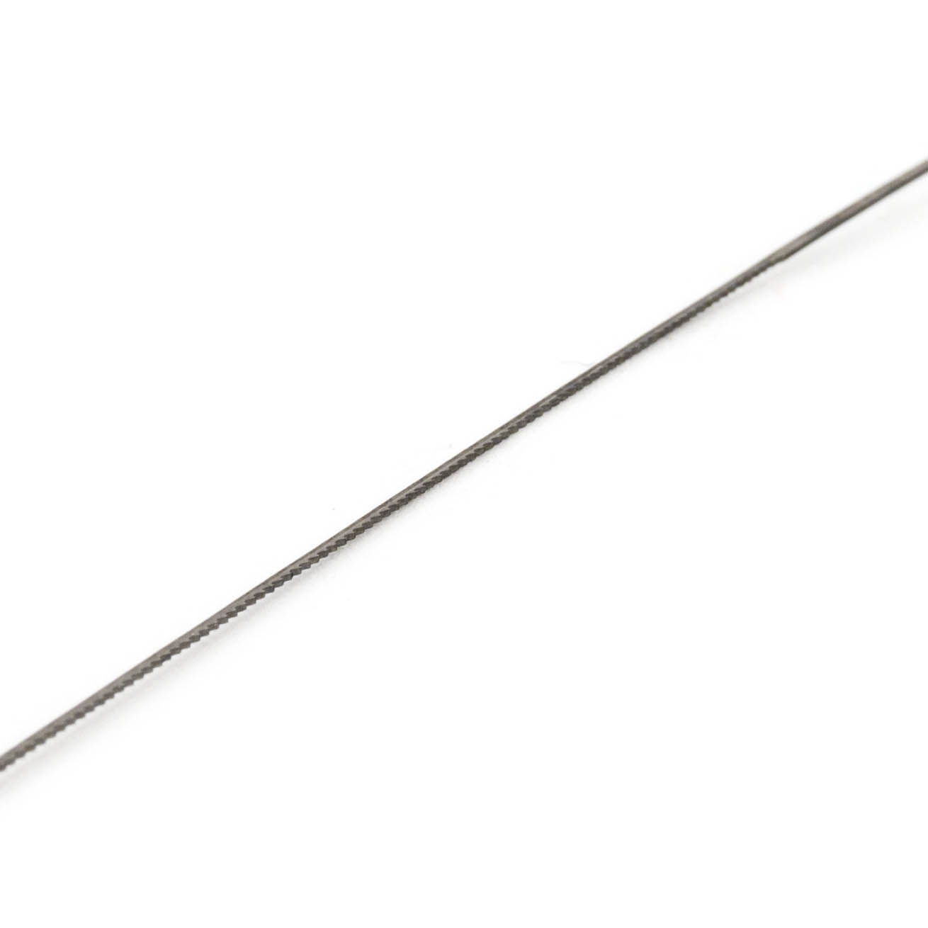 A close-up image of a saw blade for wood, size 3, showing its fine toothed edge.