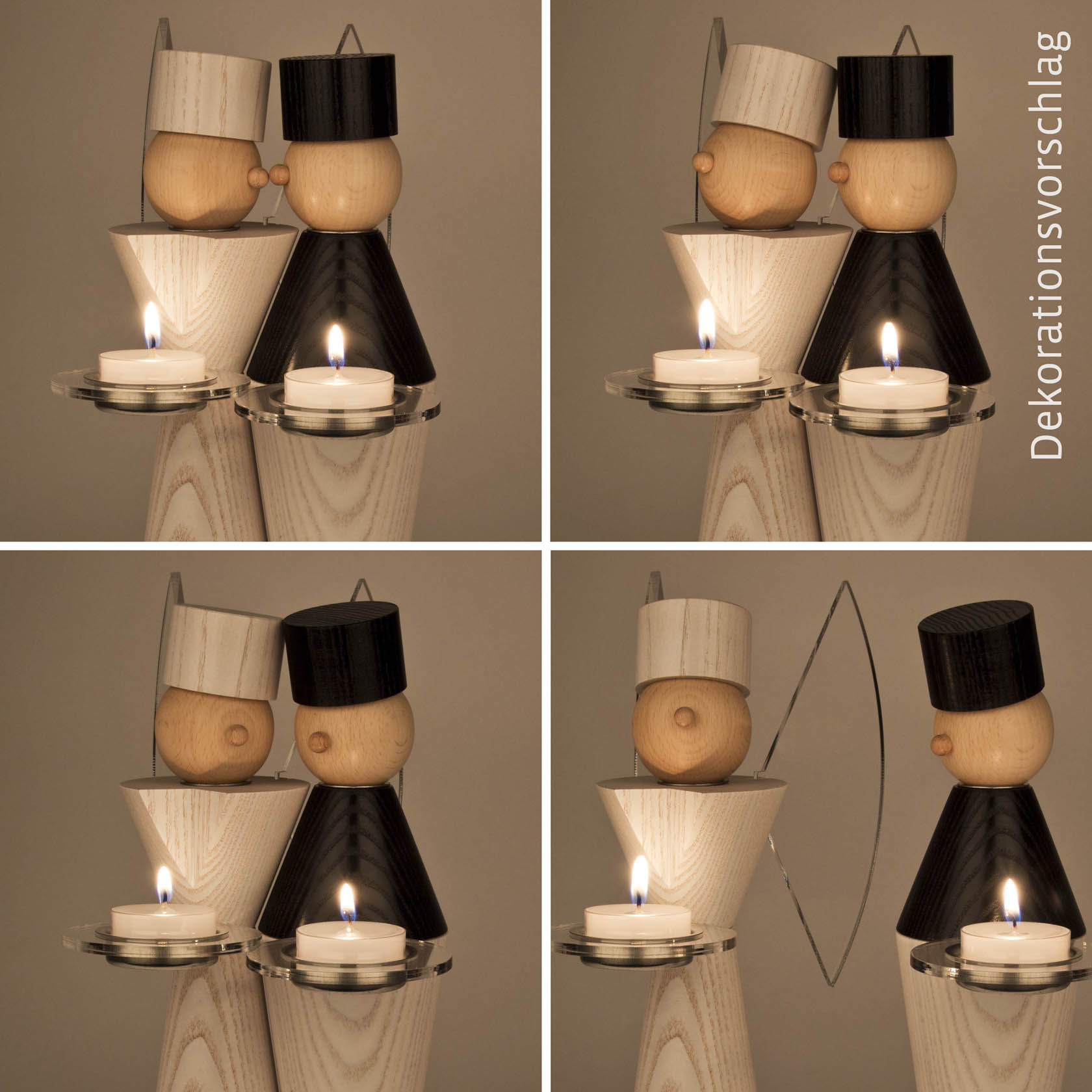 Two wooden angel figurines, one light and one dark, with halos and candles in front of them, placed on a wooden stand.