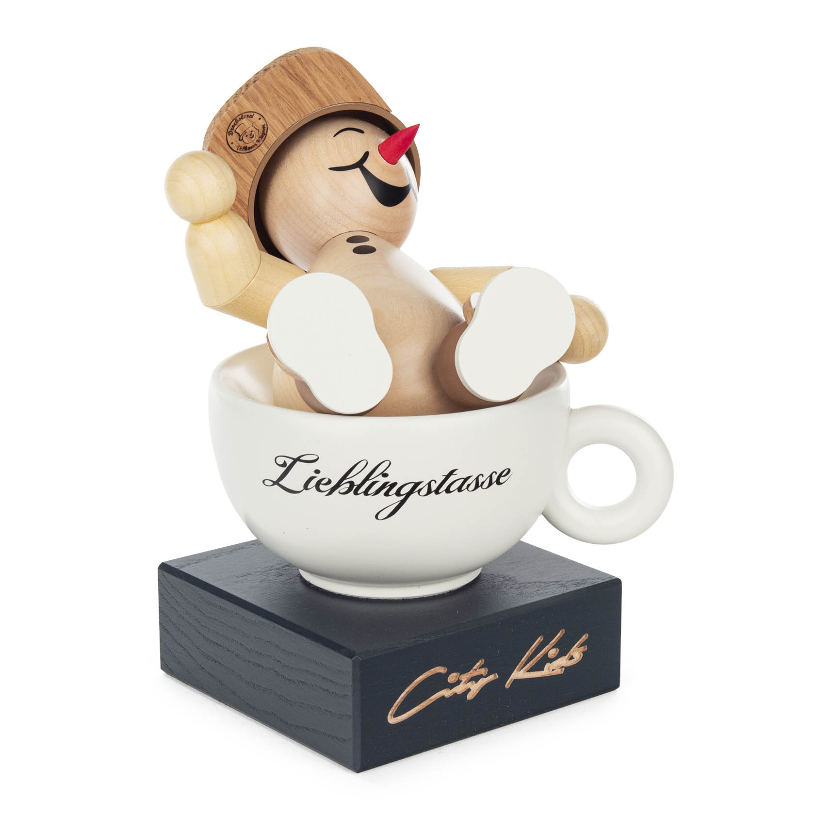 Holzfigur eines lachenden Schneemanns namens Elio, sitzend in einer Tasse mit der Aufschrift 'Lieblingstasse', auf einem Sockel mit 'City Kids' Beschriftung.
