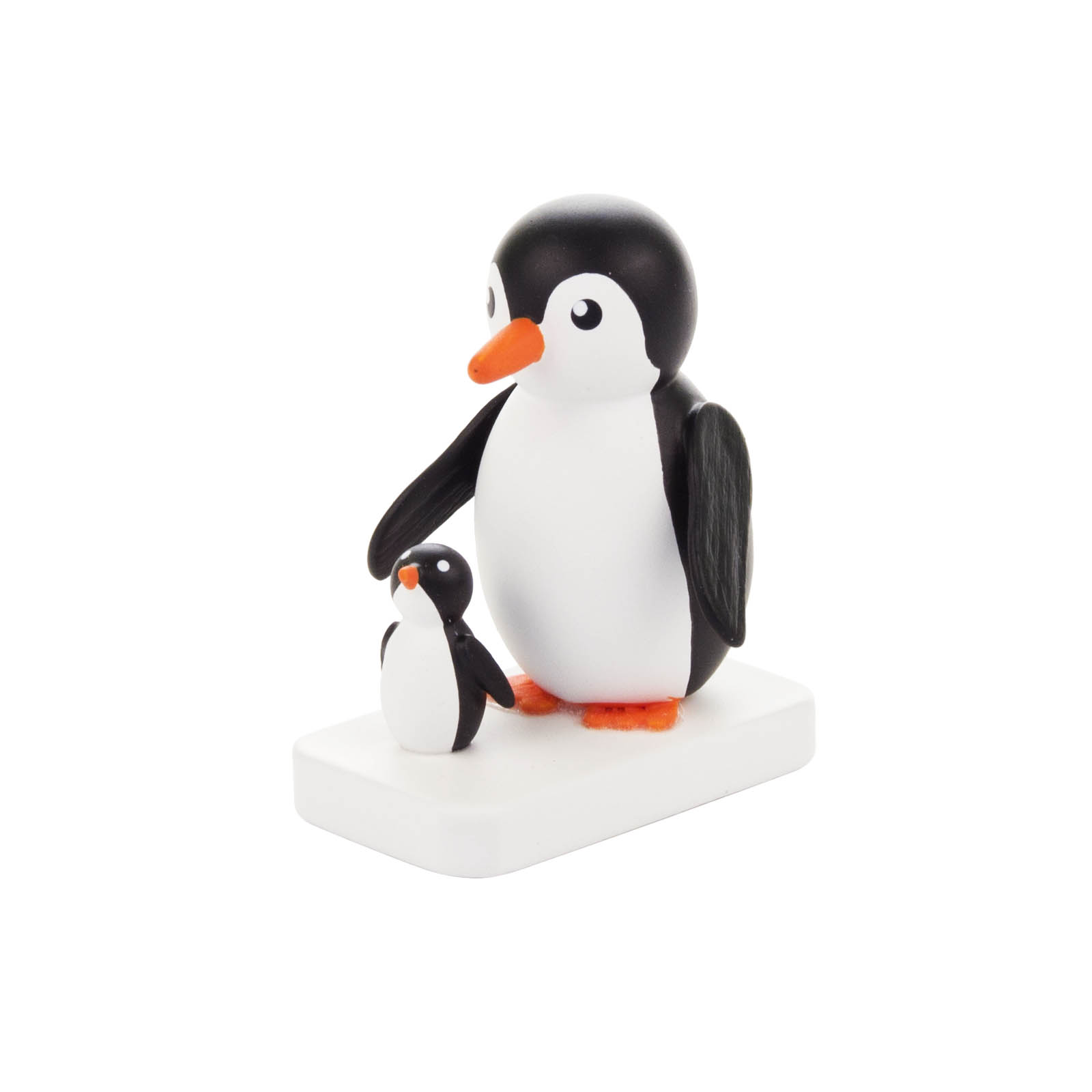 Eine schwarze weiße Pinguinfigur mit orangefarbenem Schnabel und Füßen, steht auf einem weißen Sockel, neben einer kleineren, ähnlichen Pinguinfigur. im Dregeno Online Shop günstig kaufen