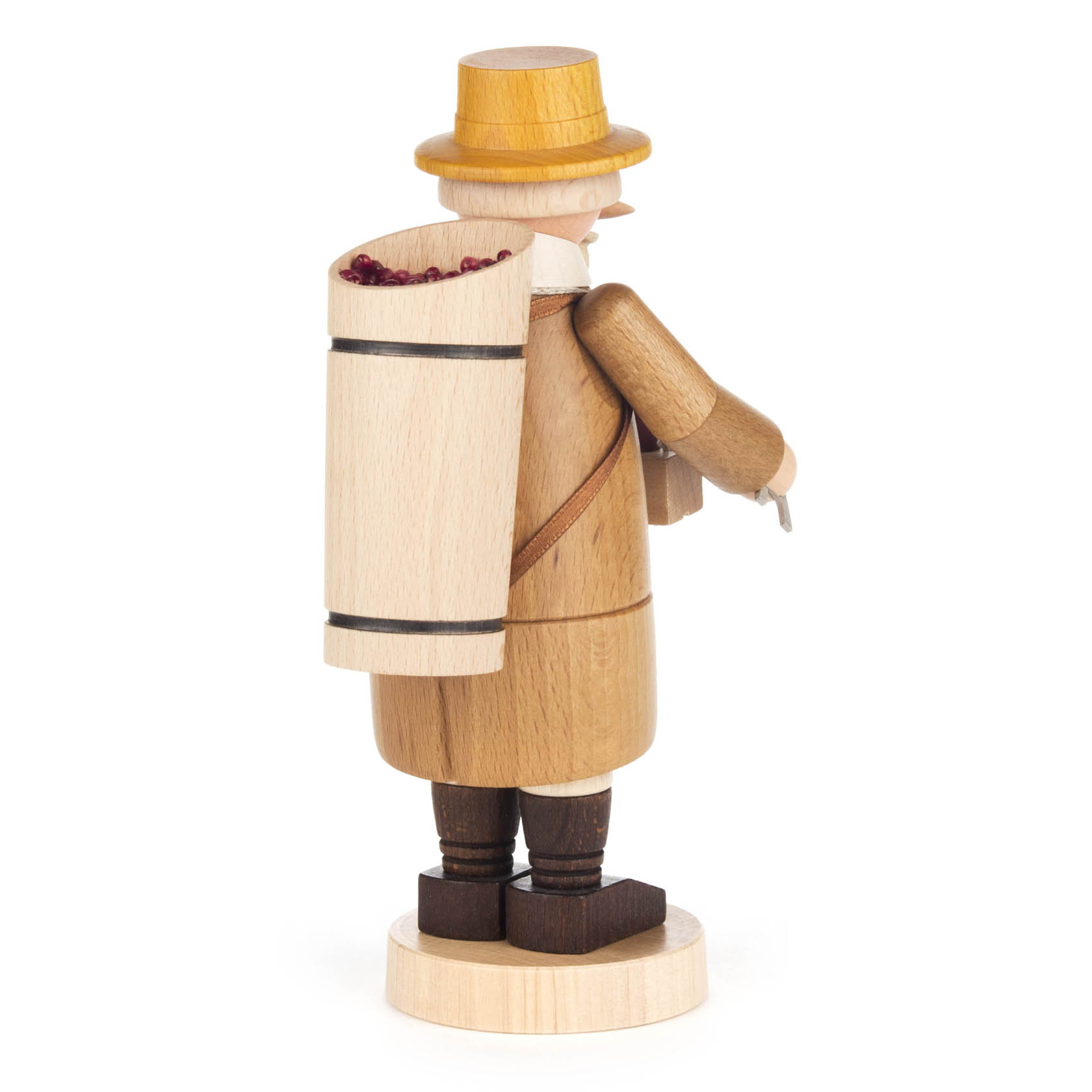 Holzfigur eines Winzers mit gelbem Hut, braunem Mantel und Weinfass auf dem Rücken.