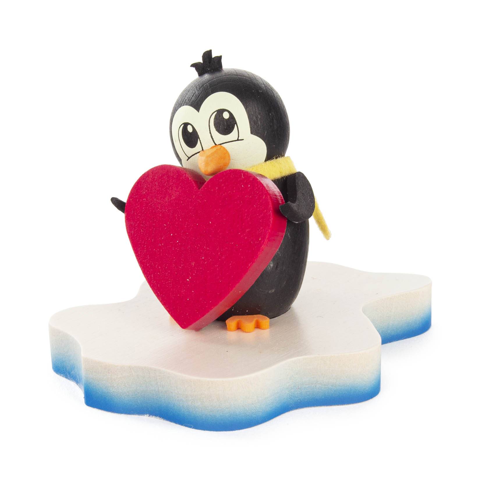 Ein süßer schwarzer Pinguin mit gelbem Schal hält ein großes rotes Herz und steht auf einer eisförmigen weißen Basis. im Dregeno Online Shop günstig kaufen