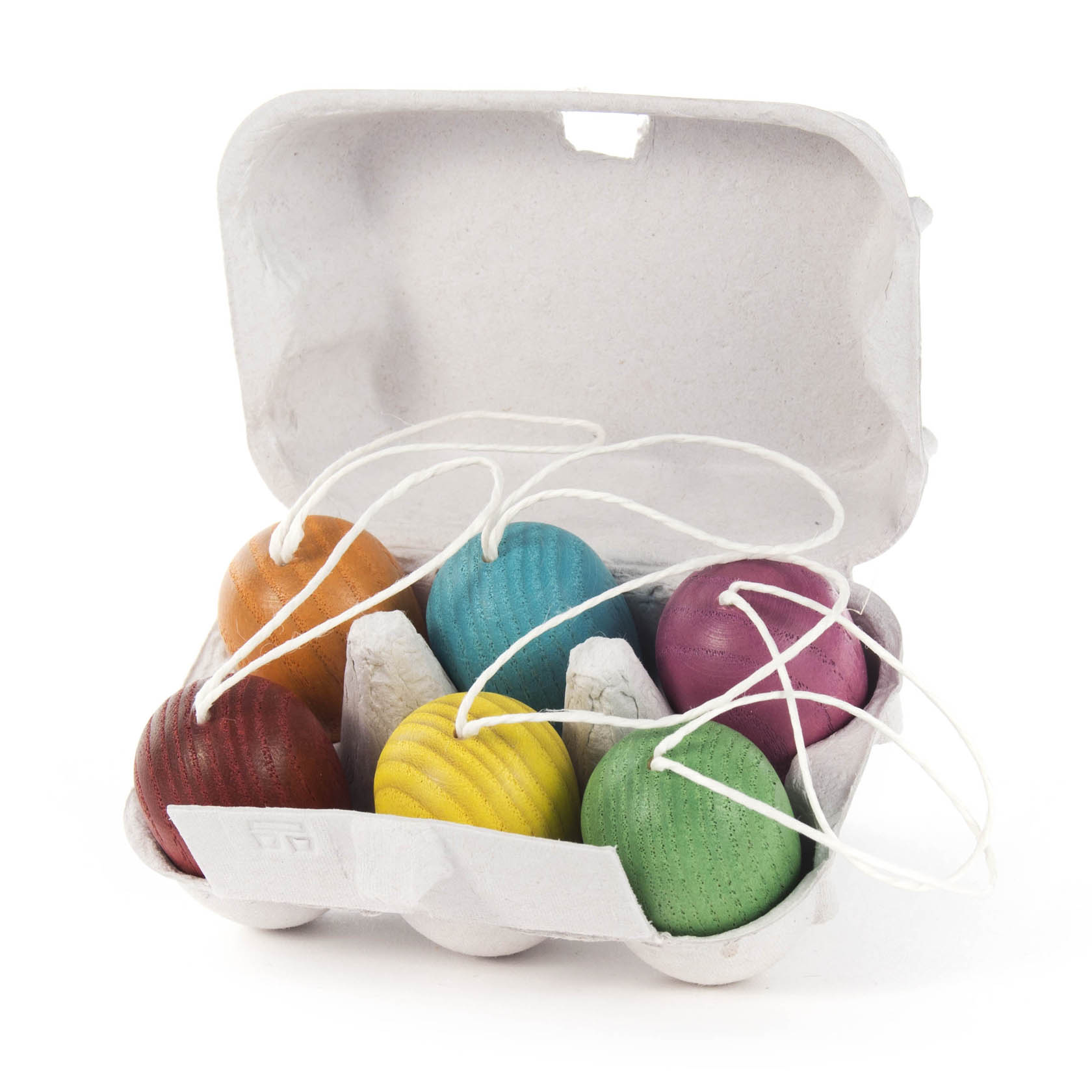 Six colorful hanging Easter eggs in a cardboard egg carton with strings attached for hanging.