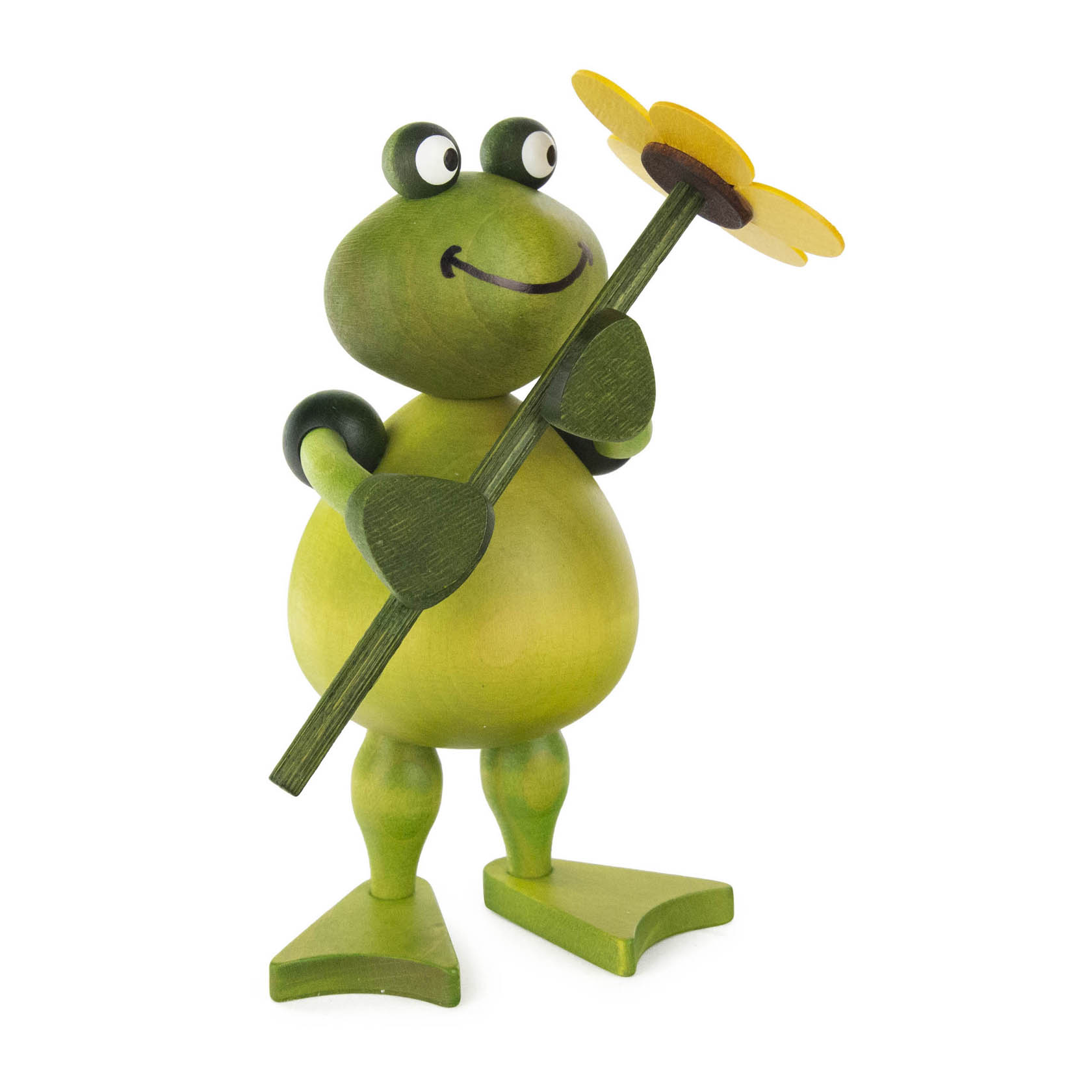 Holzfrosch Freddy mit großen Augen und einem Lächeln, hält eine gelbe Blume an einem langen Stiel. im Dregeno Online Shop günstig kaufen