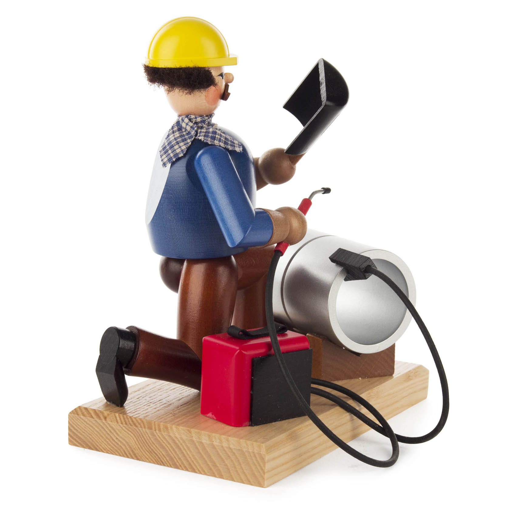 Figur eines Räuchermanns in Form eines Schweißers mit gelbem Helm, Blaumann, schwarzer Schutzbrille, hält Schweißgerät und bearbeitet silbernes Werkstück.