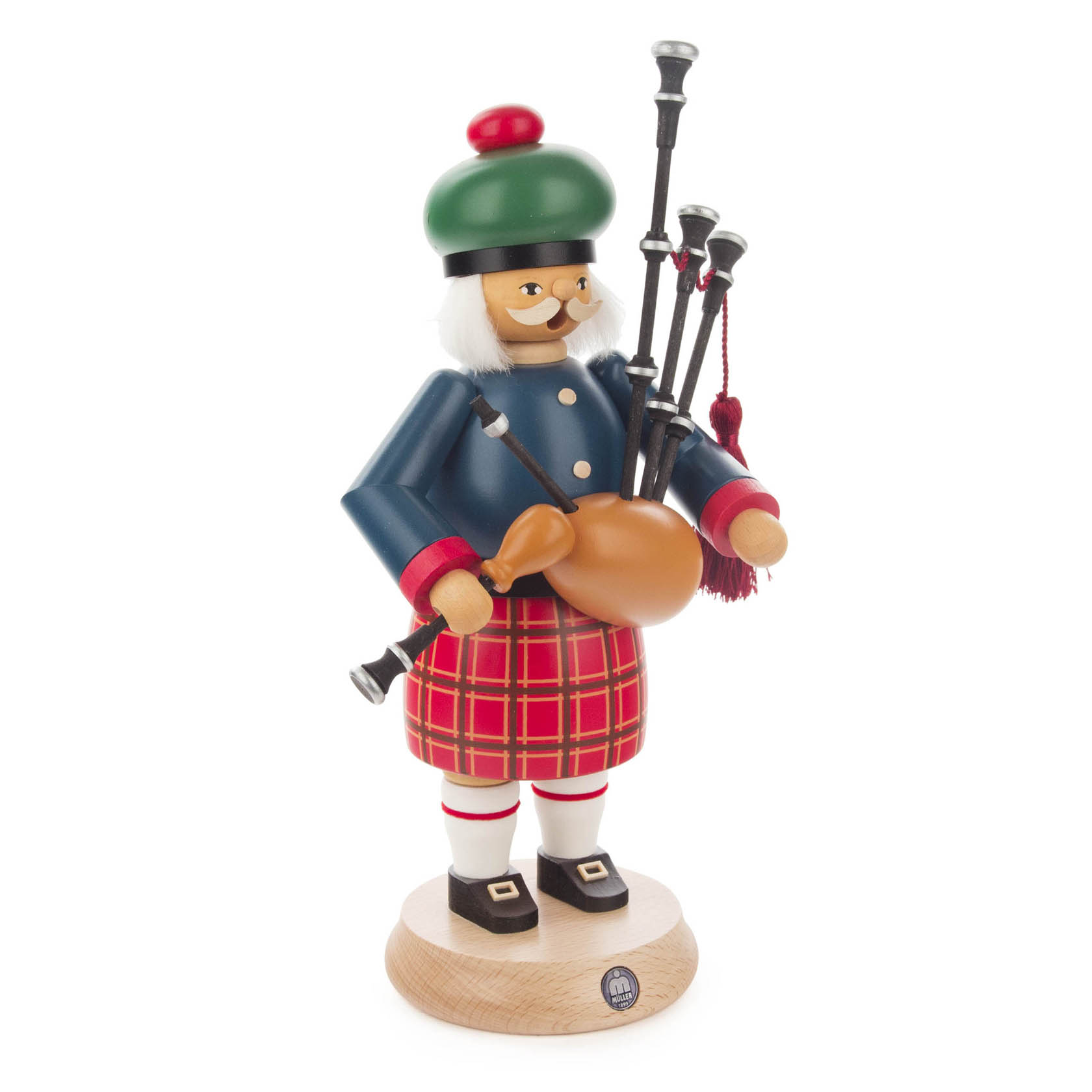 Ein traditioneller Räuchermann in Form eines Schotten, der einen Dudelsack trägt. Er hat einen karierten Schottenrock und einen grünen Hut mit rotem Bommel.