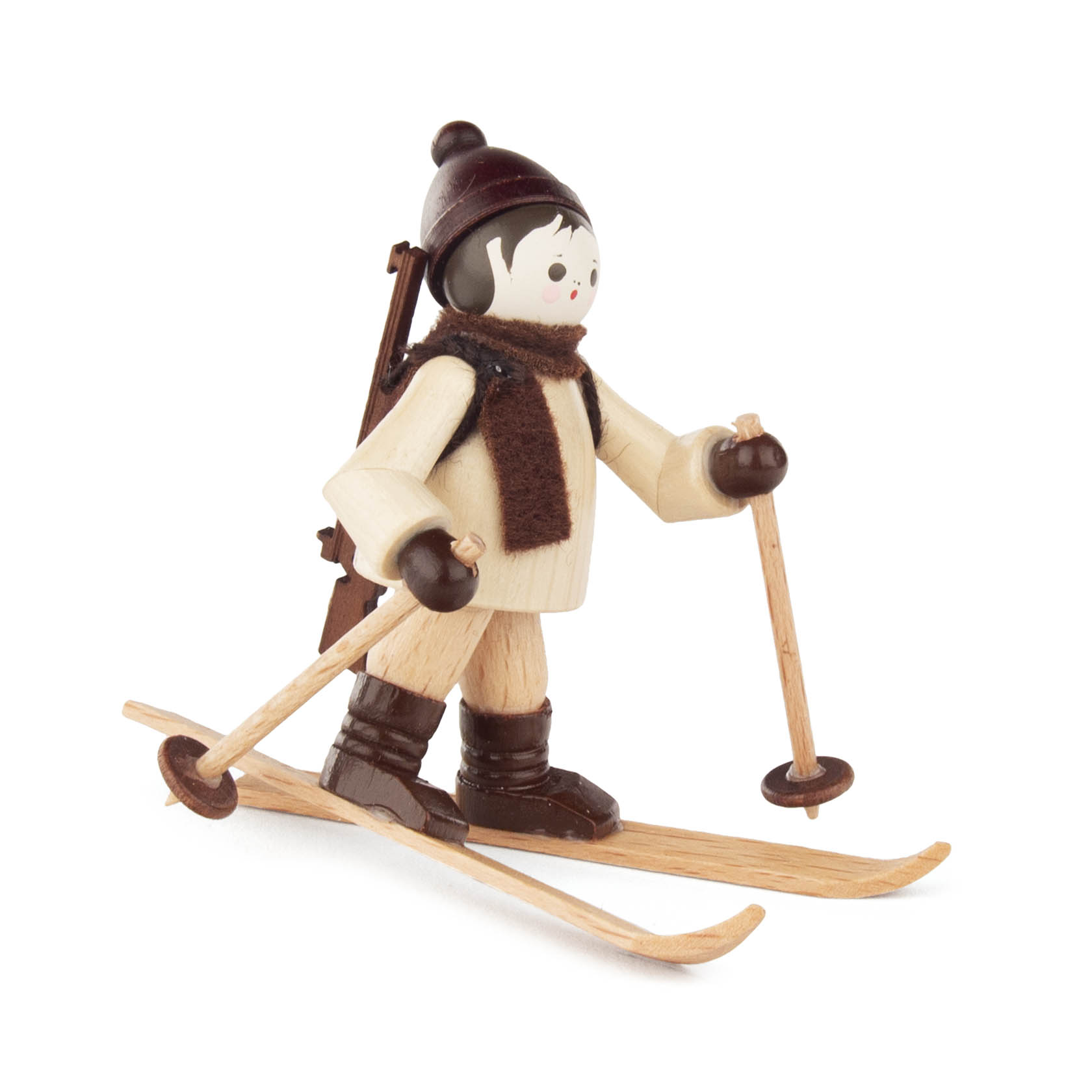 Holzfigur eines Biathleten mit Skiern und Gewehr auf dem Rücken, in Winterkleidung mit Mütze und Schal. im Dregeno Online Shop günstig kaufen