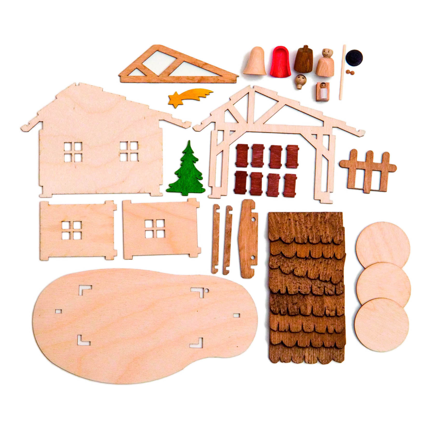 Bastelset für einen Krippenstall mit Holzplatten, Figuren, Baum, Zaun, Stern und runden Basisteilen. Die Teile sind vorbereitet zum Zusammenbauen.
