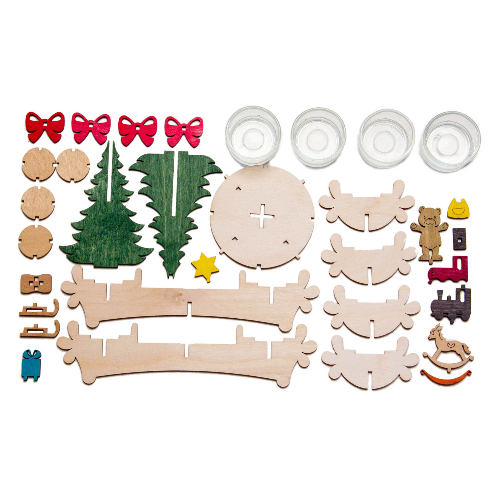 A DIY advent candle holder set, featuring wooden pieces including reindeer antlers, trees, teddy bear, sled with gifts, small glass holders, and red bows.