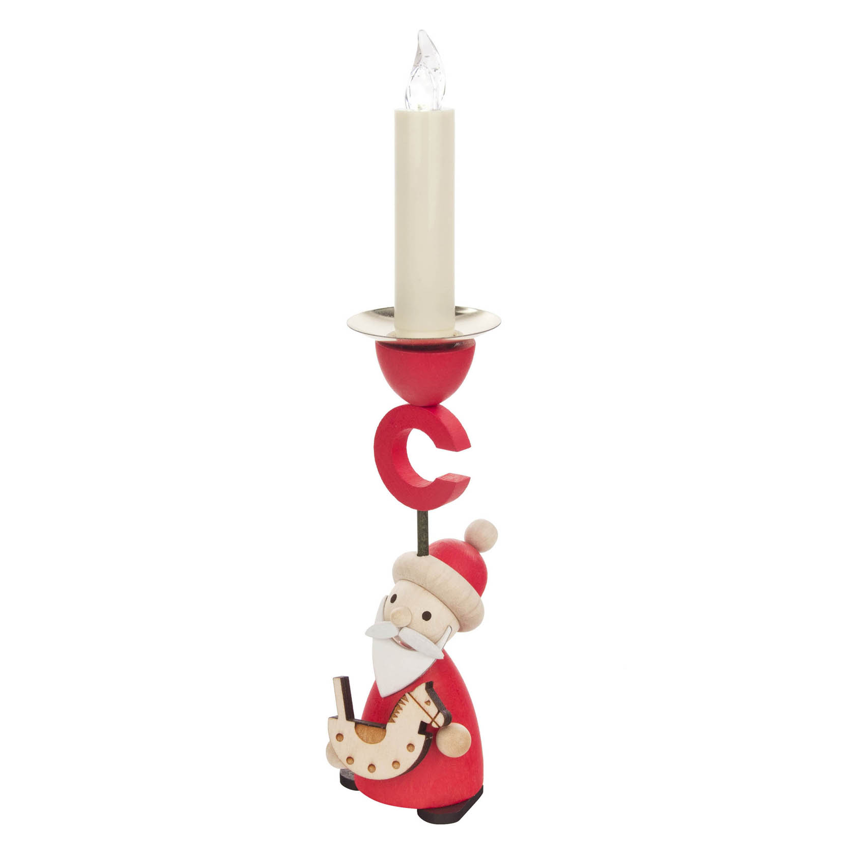 A candle holder featuring a wooden figure of Santa Claus holding a rocking horse. The holder is painted in red and white, with a candle on top.