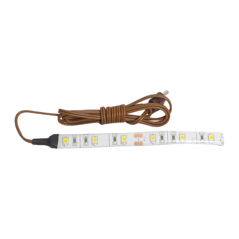 LED-Streifen, 10 cm lang, mit 6 gelben LED-Leuchten. Das Band hat ein braunes Anschlusskabel und ist für eine Spannung von 3,5-5 V geeignet. im Dregeno Online Shop günstig kaufen