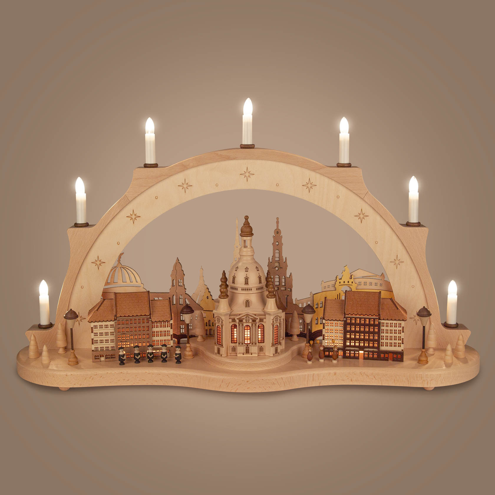 A wooden arch-shaped candle holder featuring the Dresden Frauenkirche, with electric candles and detailed miniature buildings of the city.