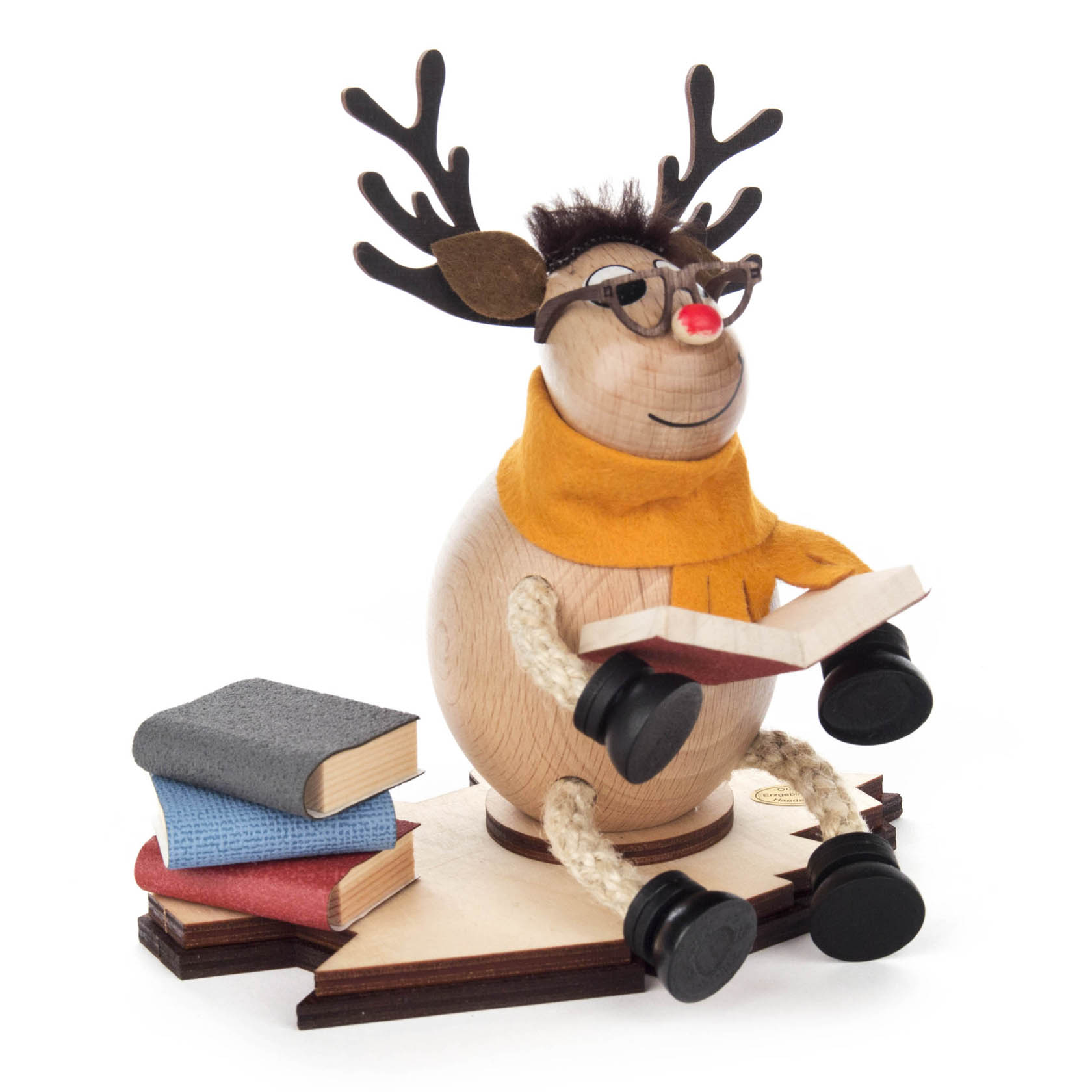 Holzfigur eines Elchs mit Brille und Schal, der auf einer Buchseite sitzt und ein Buch liest. Daneben liegen zwei weitere Bücher. im Dregeno Online Shop günstig kaufen