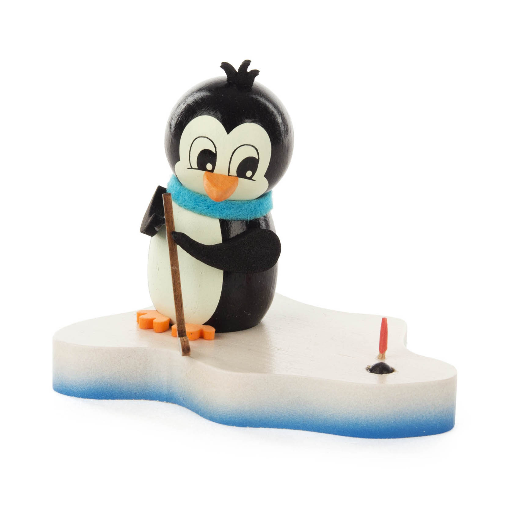 Eine Holzfigur eines Pinguins mit einem Golfschläger auf einer schneeförmigen Basis. Der Pinguin trägt einen blauen Schal und zielt auf ein kleines rotes Fähnchen. im Dregeno Online Shop günstig kaufen