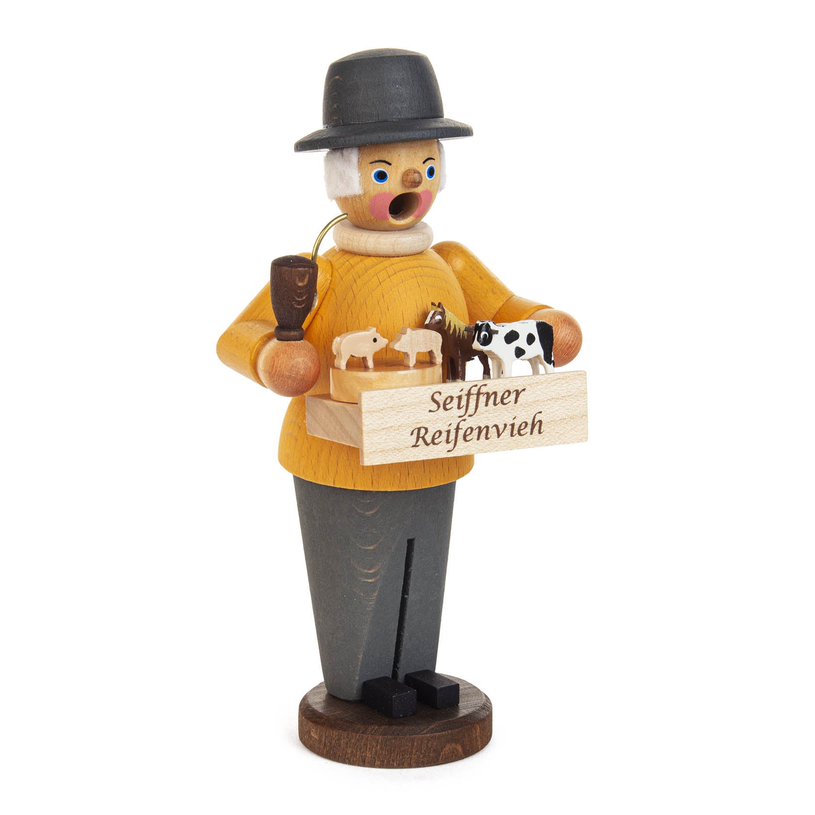 Eine Mini-Räucherfigur in gelber Jacke und schwarzem Hut, hält eine Kiste mit kleinen Reifentieren und einer Pfeife im Mund, mit Aufschrift 'Seiffner Reifenvieh'.